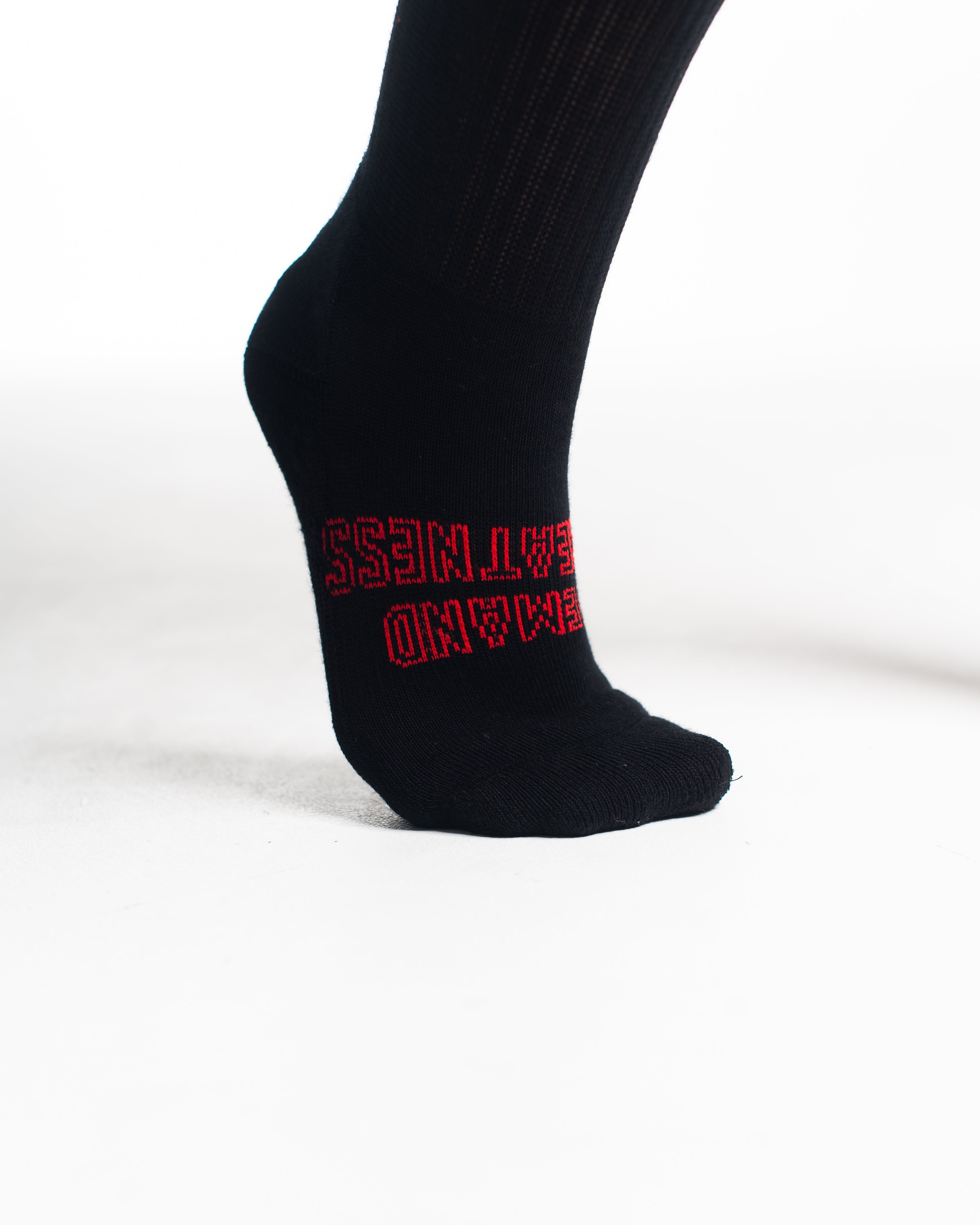 Close-up of knit texture on Red Dawn deadlift socks, emphasizing sturdy fabric and smooth stitching.