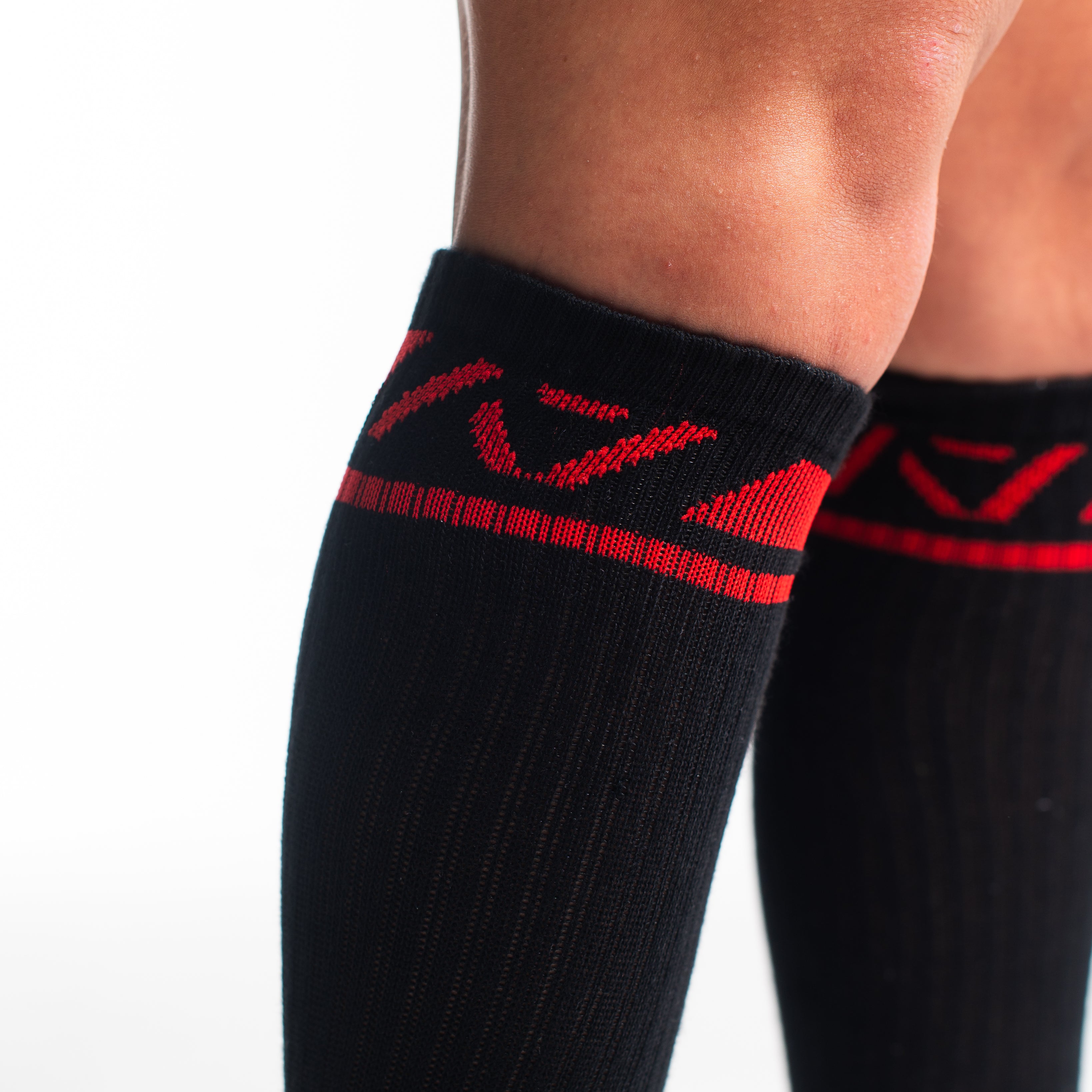 Close-up of knit texture on Red Dawn deadlift socks, emphasizing sturdy fabric and smooth stitching.