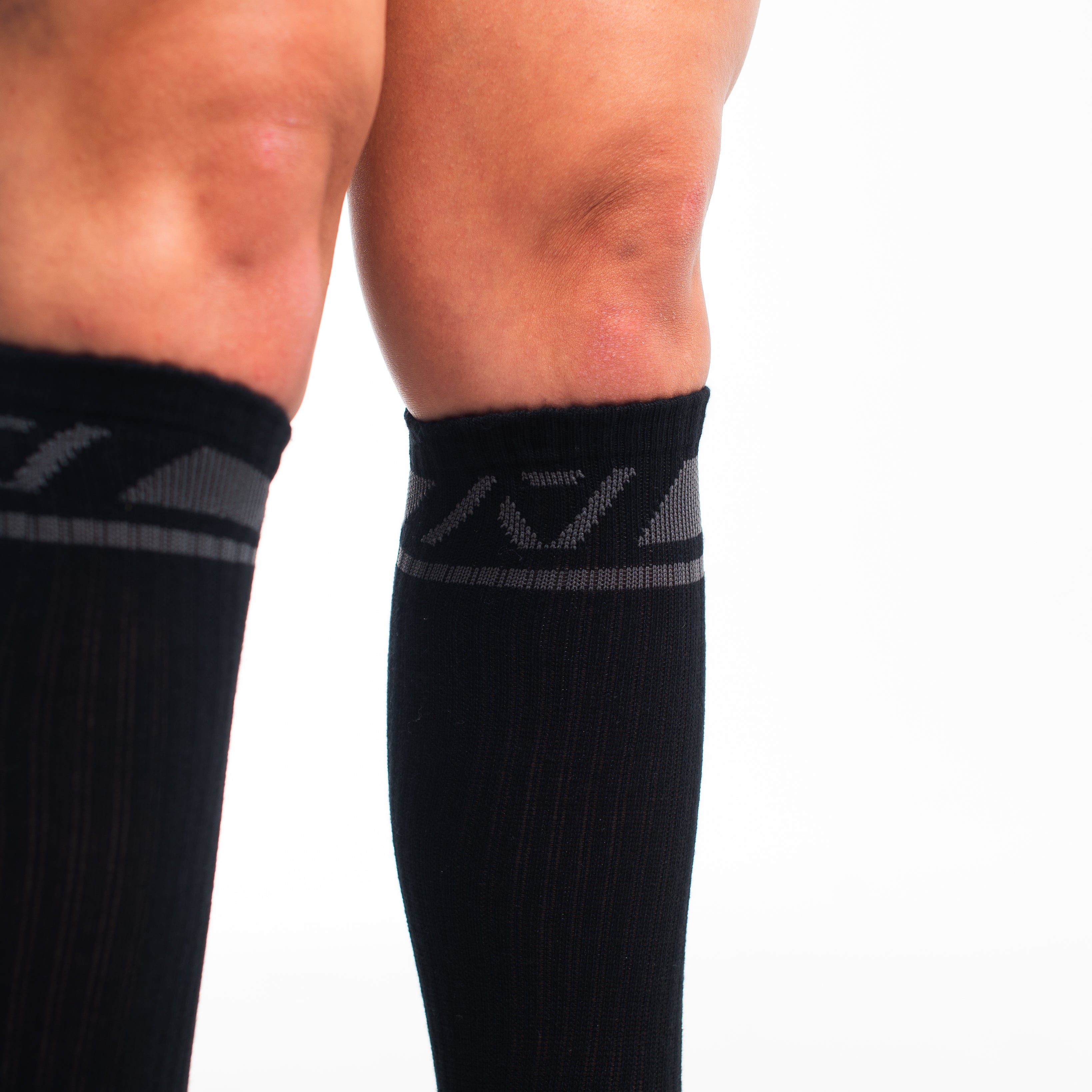 Close-up of knit fabric on Shadow Stone socks, showing stitch detail and high-quality material.