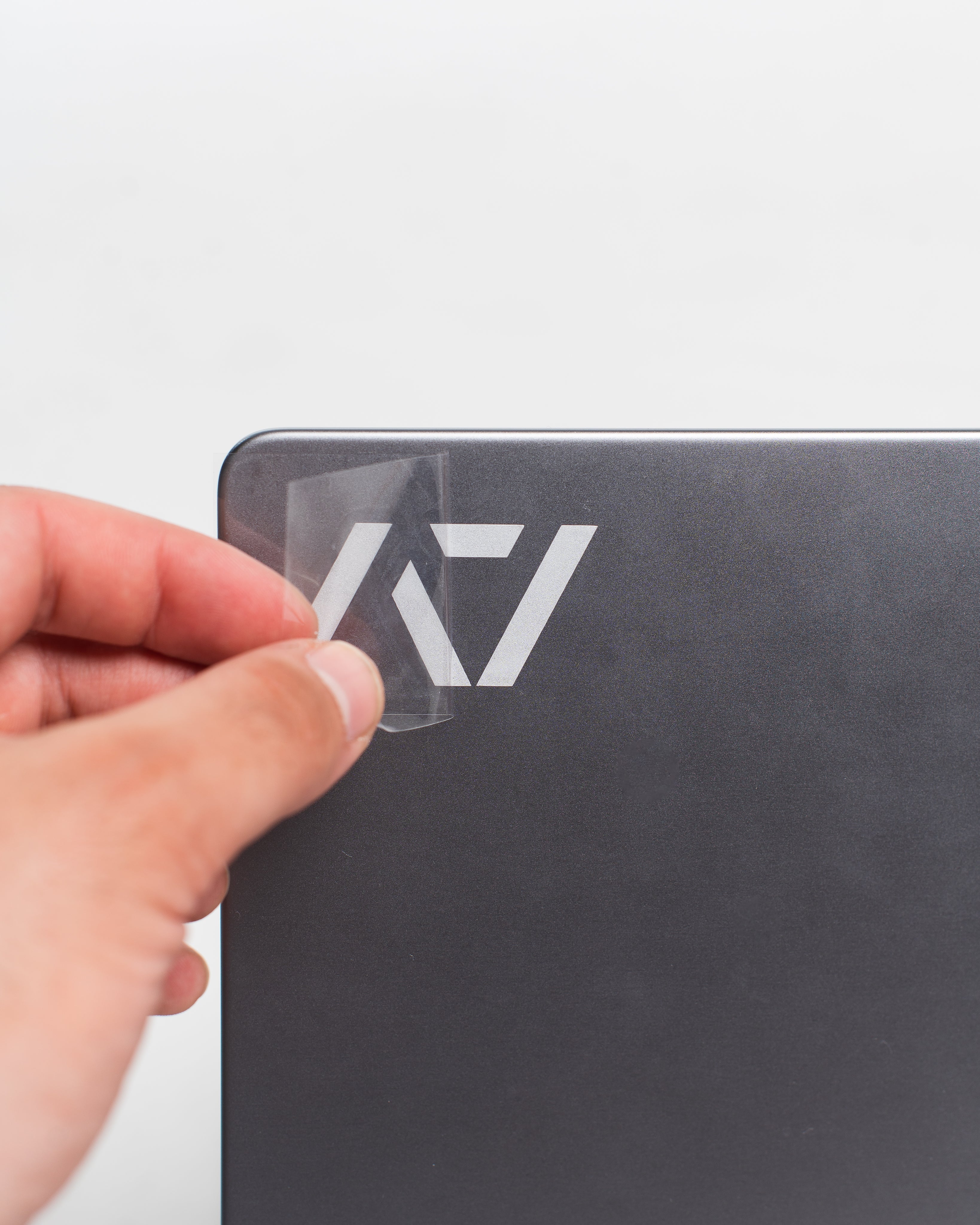 A7 Silver Decal being applied to a laptop, showing easy peel-and-stick installation process.