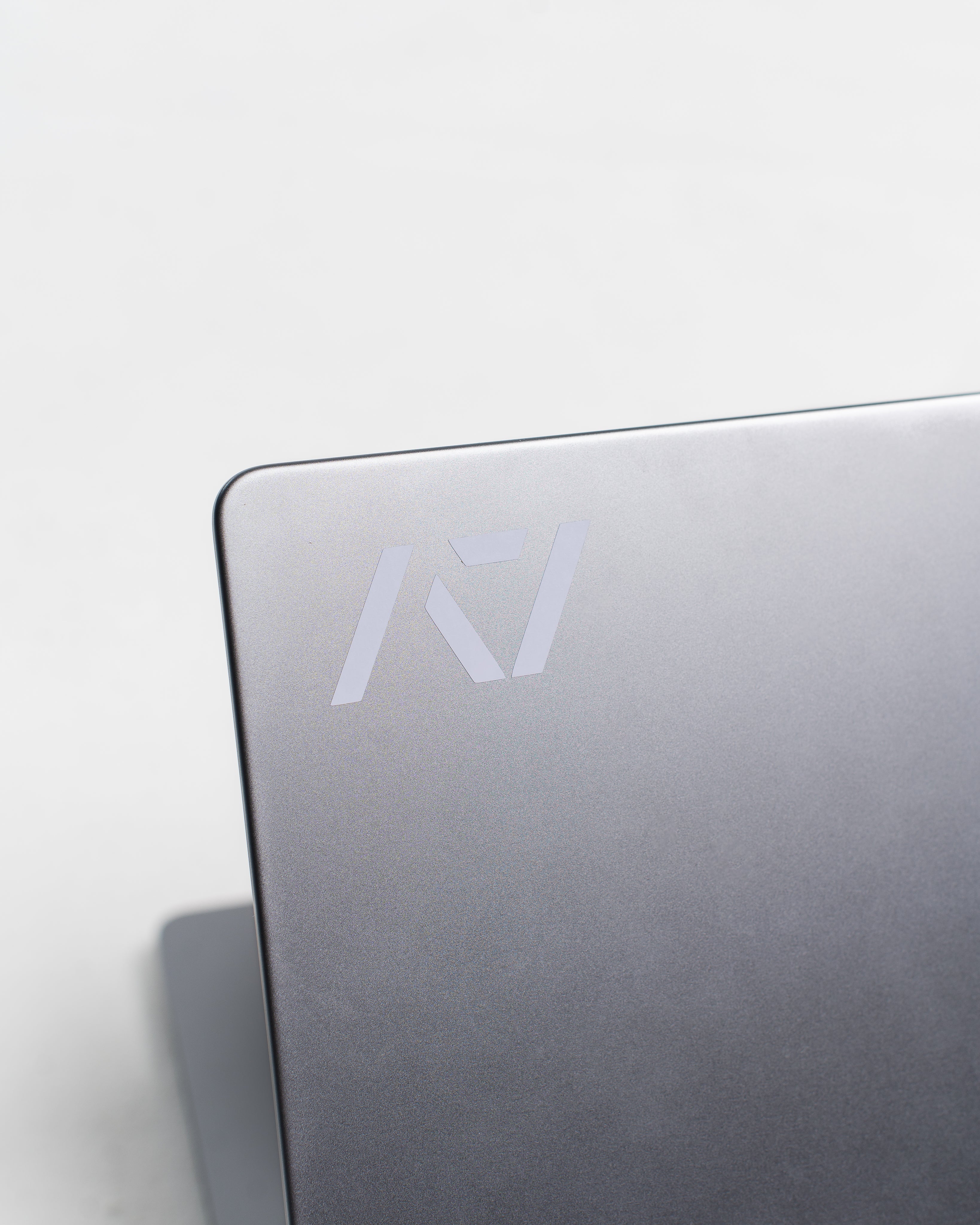 A7 Silver Decal applied to a laptop, showing minimalist style and durable finish in use.