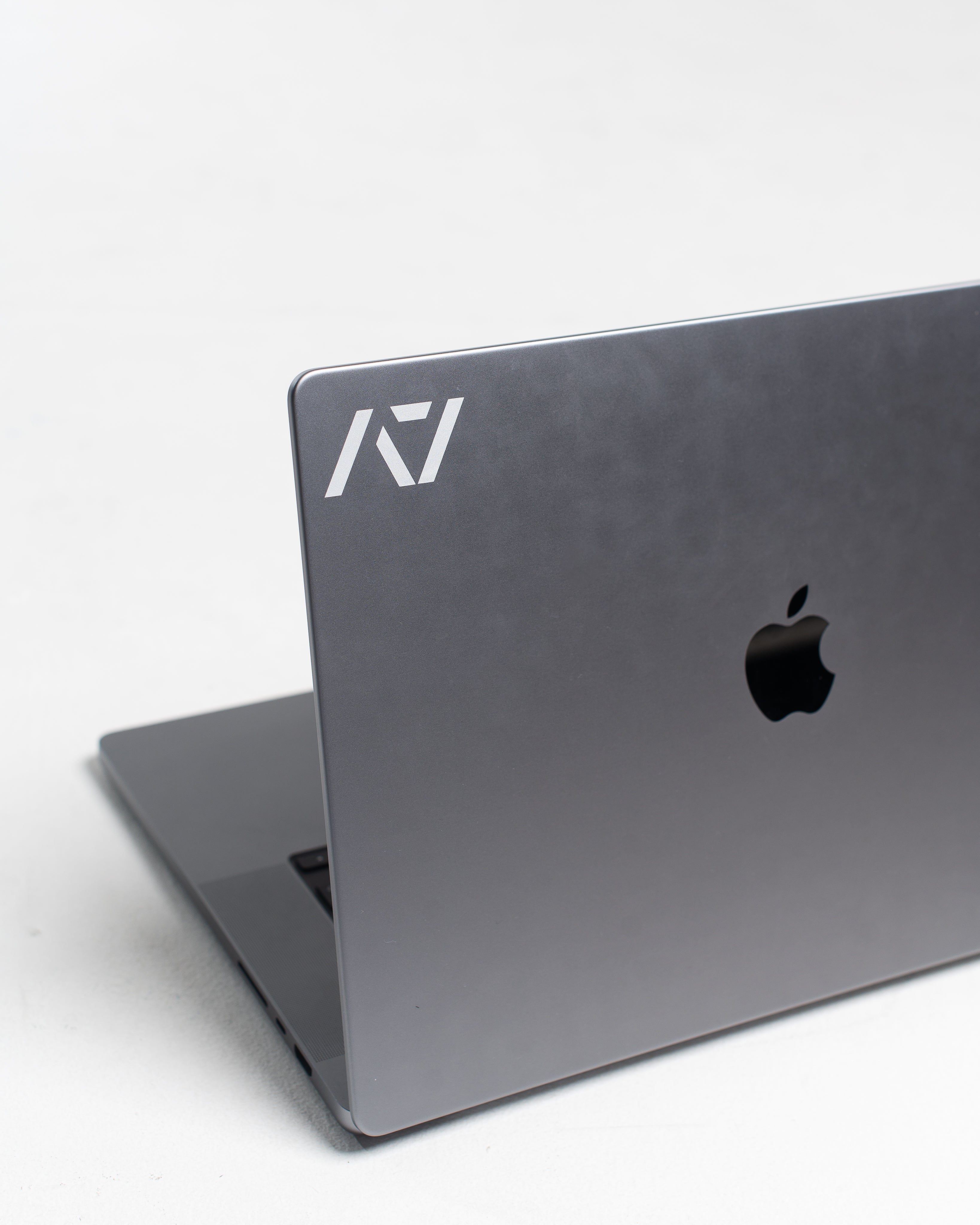 A7 White Decal applied to a dark laptop surface, showcasing bold contrast and clean application.