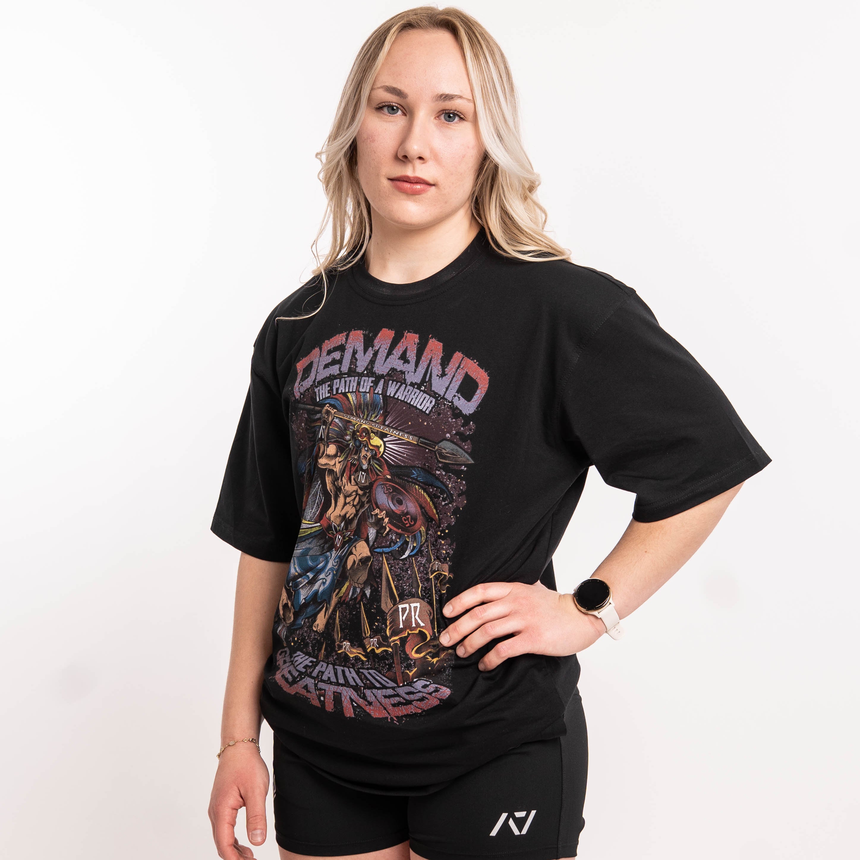 Side profile of Aztec Warrior Over-Fit Unisex Shirt demonstrating the relaxed fit and sleeve length.