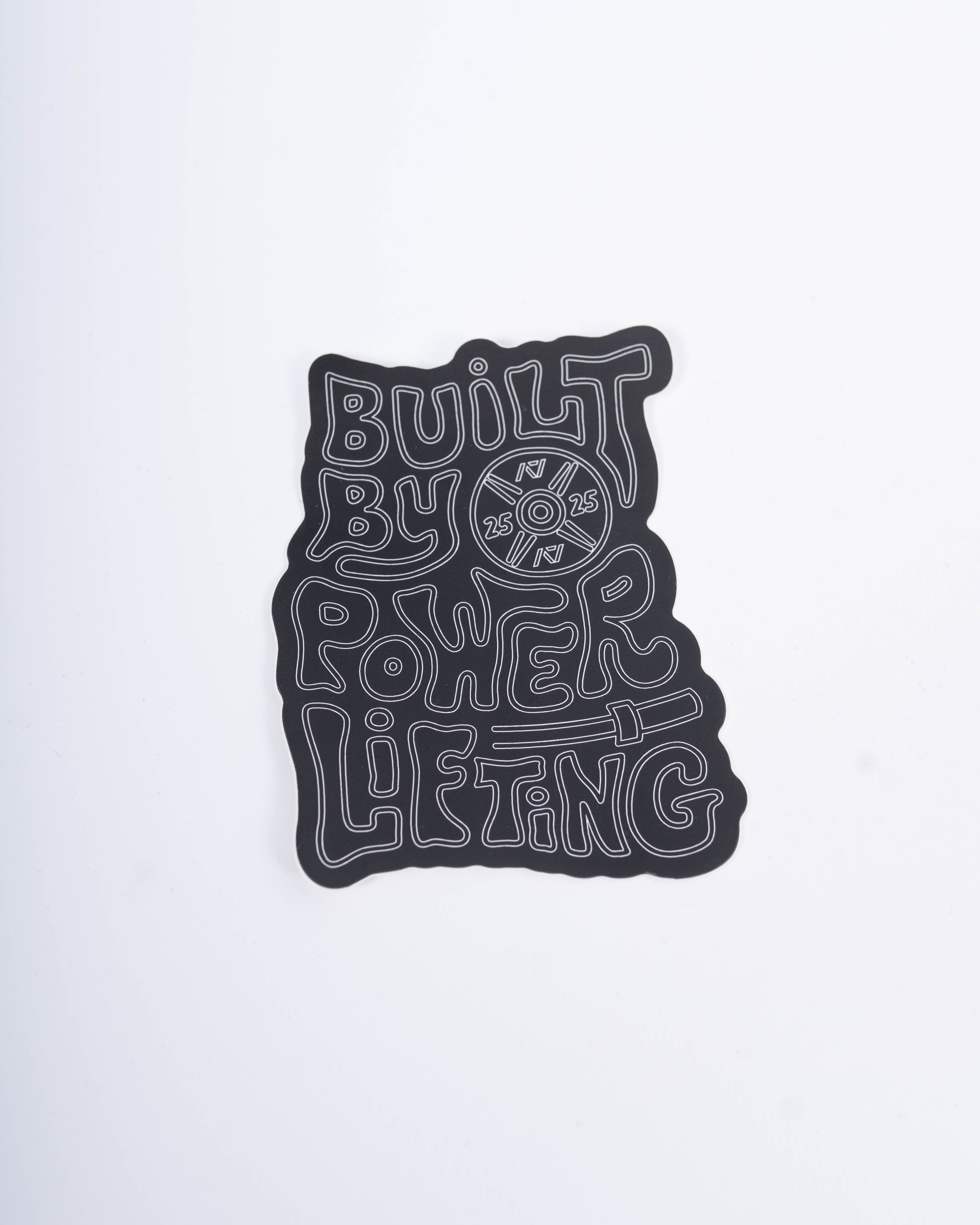 Front view of A7 Built By Sticker showcasing bold "Built By Powerlifting" text on matte polypropylene.