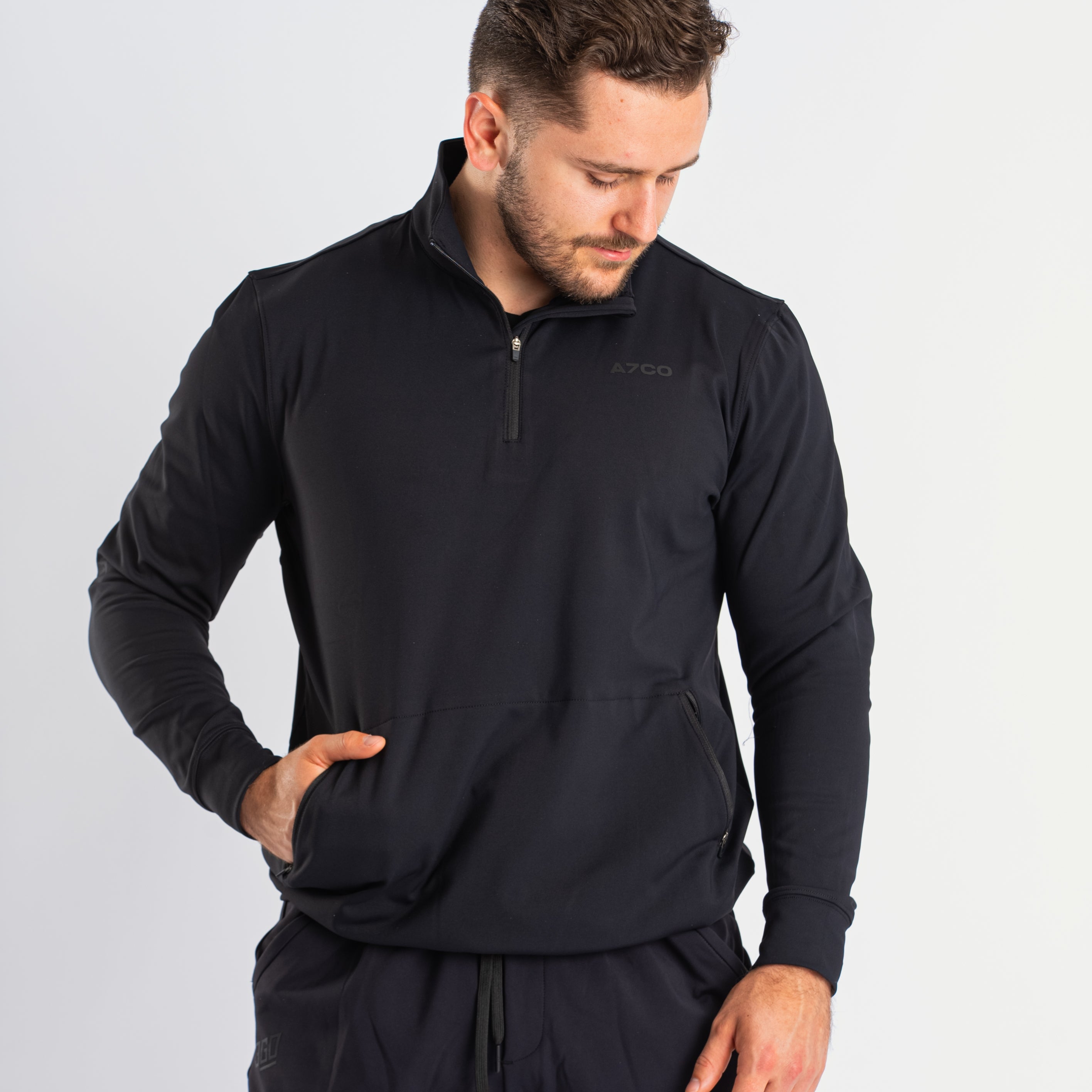 Front view of A7 Cobra Quarter Zip Jacket in Stealth, showcasing the sleek design and quarter zip feature.