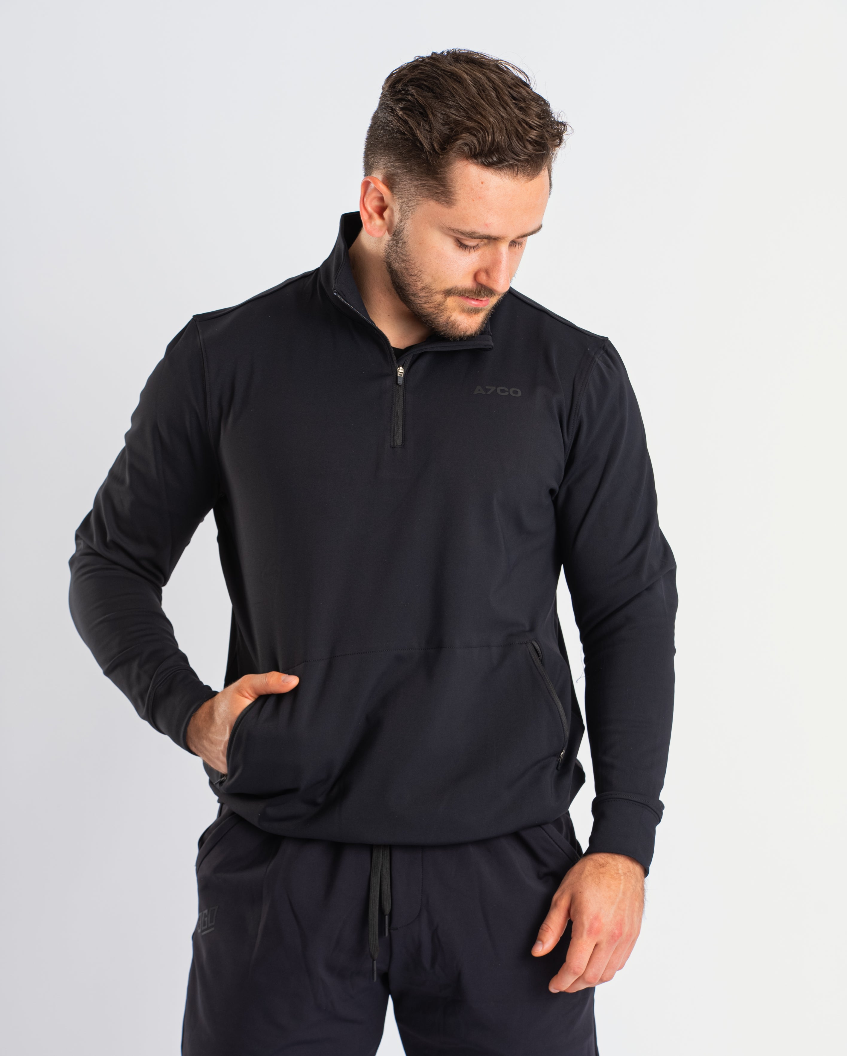 Front view of A7 Cobra Quarter Zip Jacket in Stealth, showcasing the sleek design and quarter zip feature.