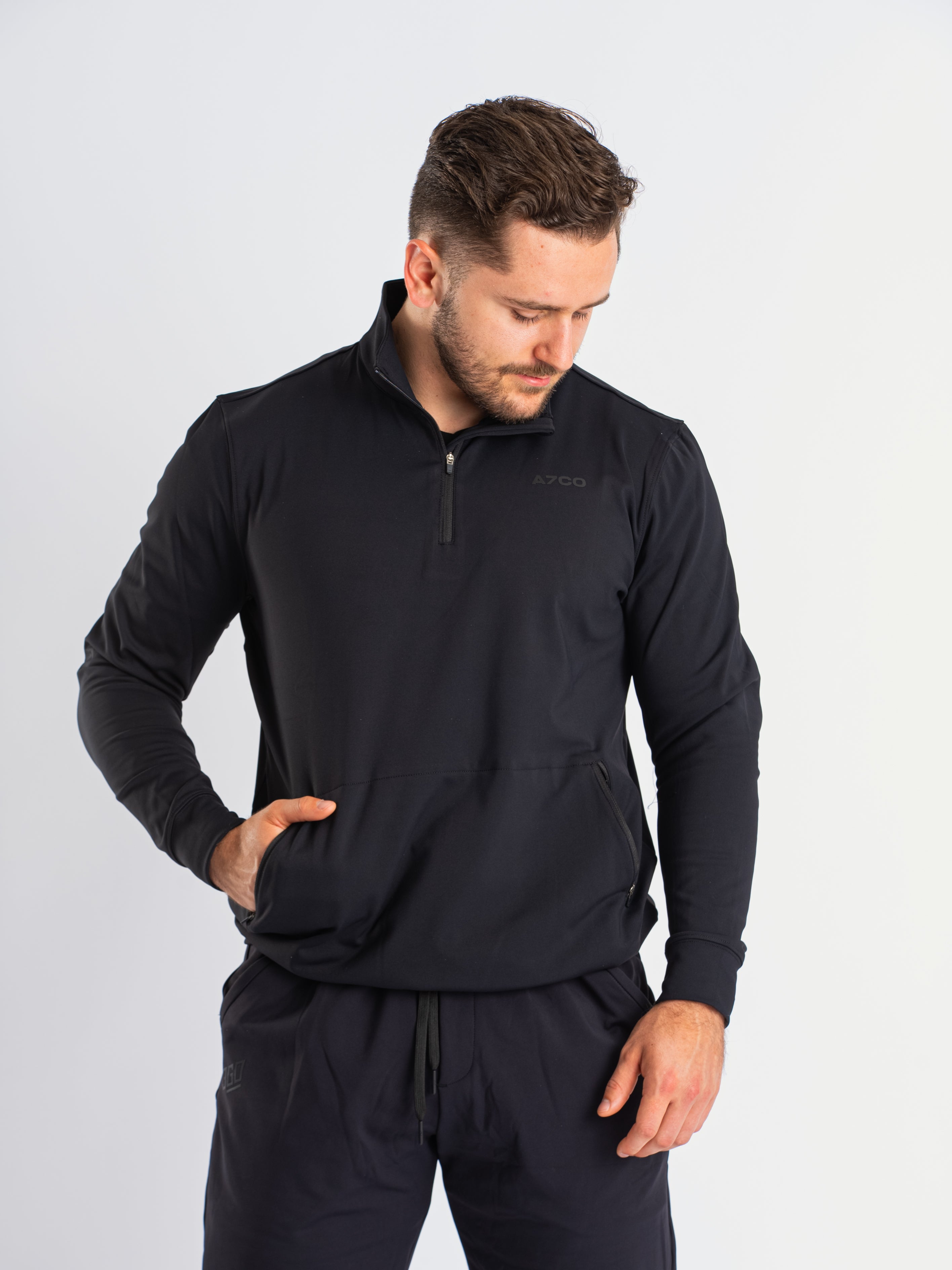 Front view of A7 Cobra Quarter Zip Jacket in Stealth, showcasing the sleek design and quarter zip feature.