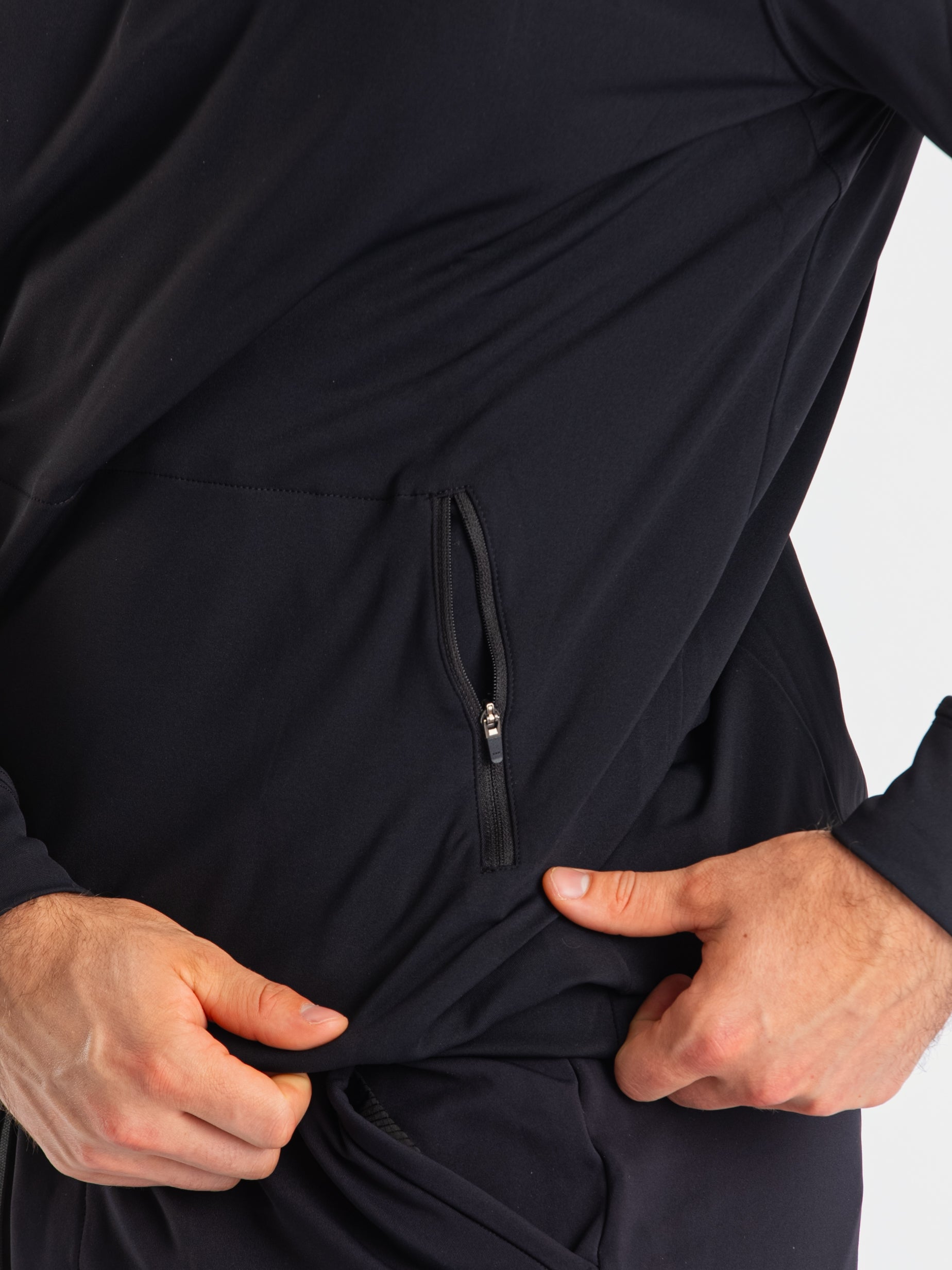 Close-up of the zippered pocket on the A7 Cobra Quarter Zip Jacket – Stealth, designed for secure storage with a clean, minimalist finish.