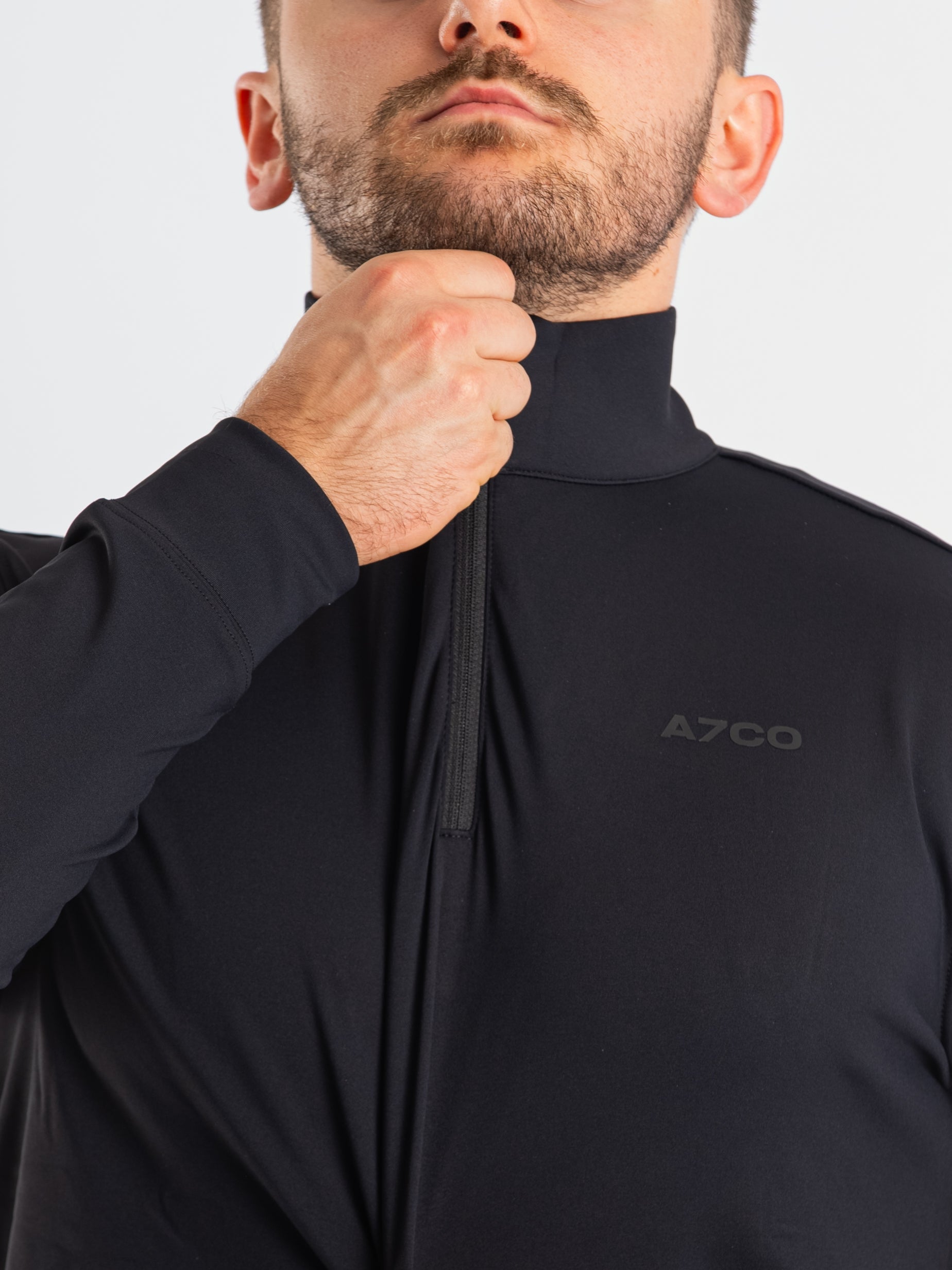 Close-up of the YKK quarter zipper on the A7 Cobra Quarter Zip Jacket – Stealth, highlighting durable construction and clean collar finish.