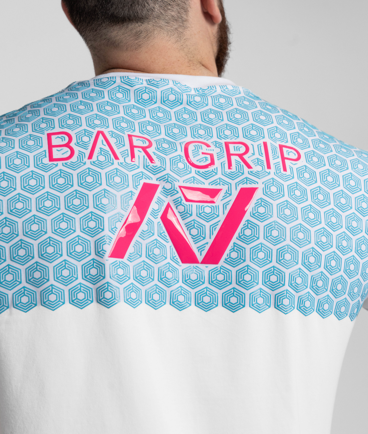 Close up of pink and blue bar grip on code shirt