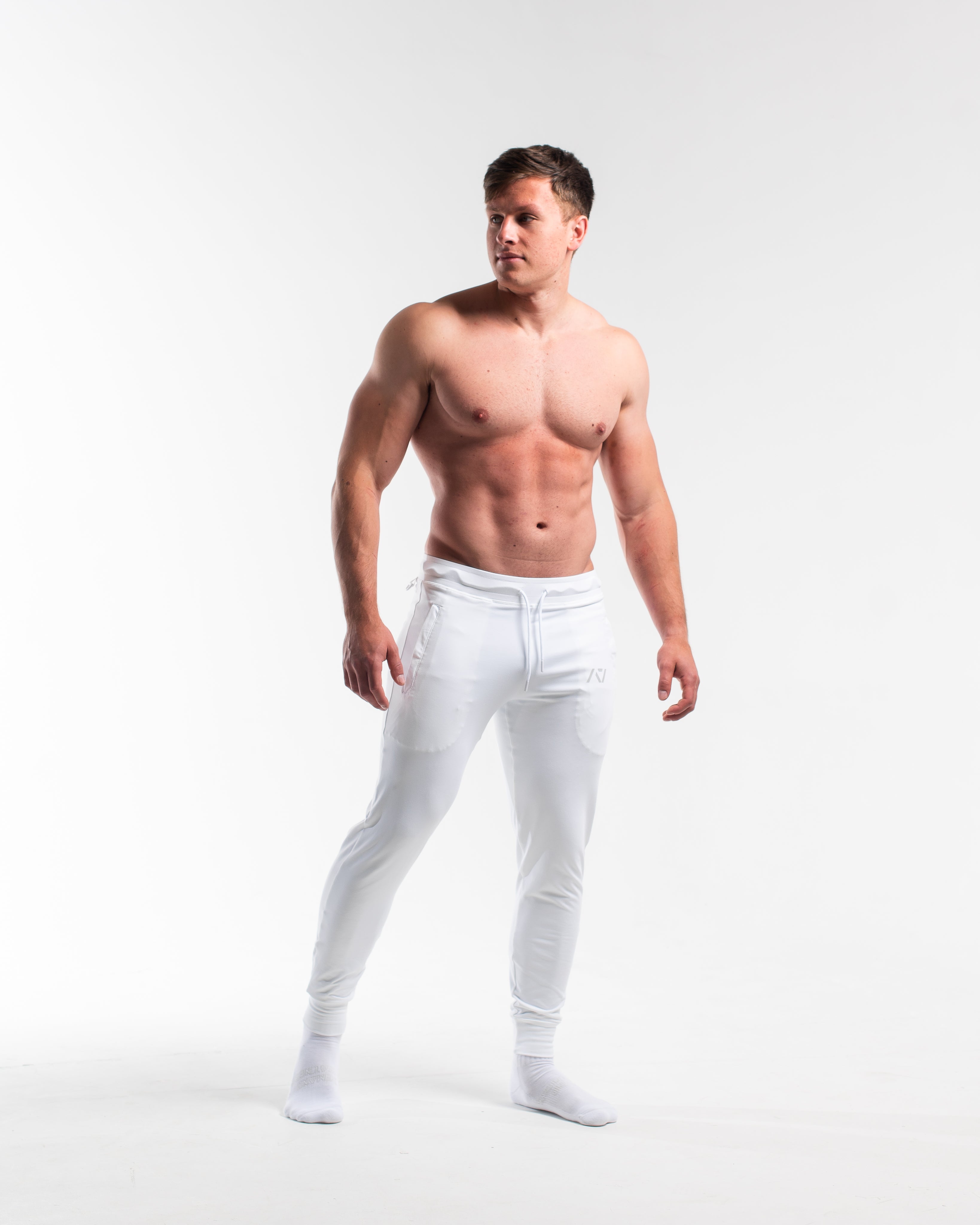Front view of Polar Defy Joggers showing mid-rise waist, tapered legs, and zippered front pockets.
