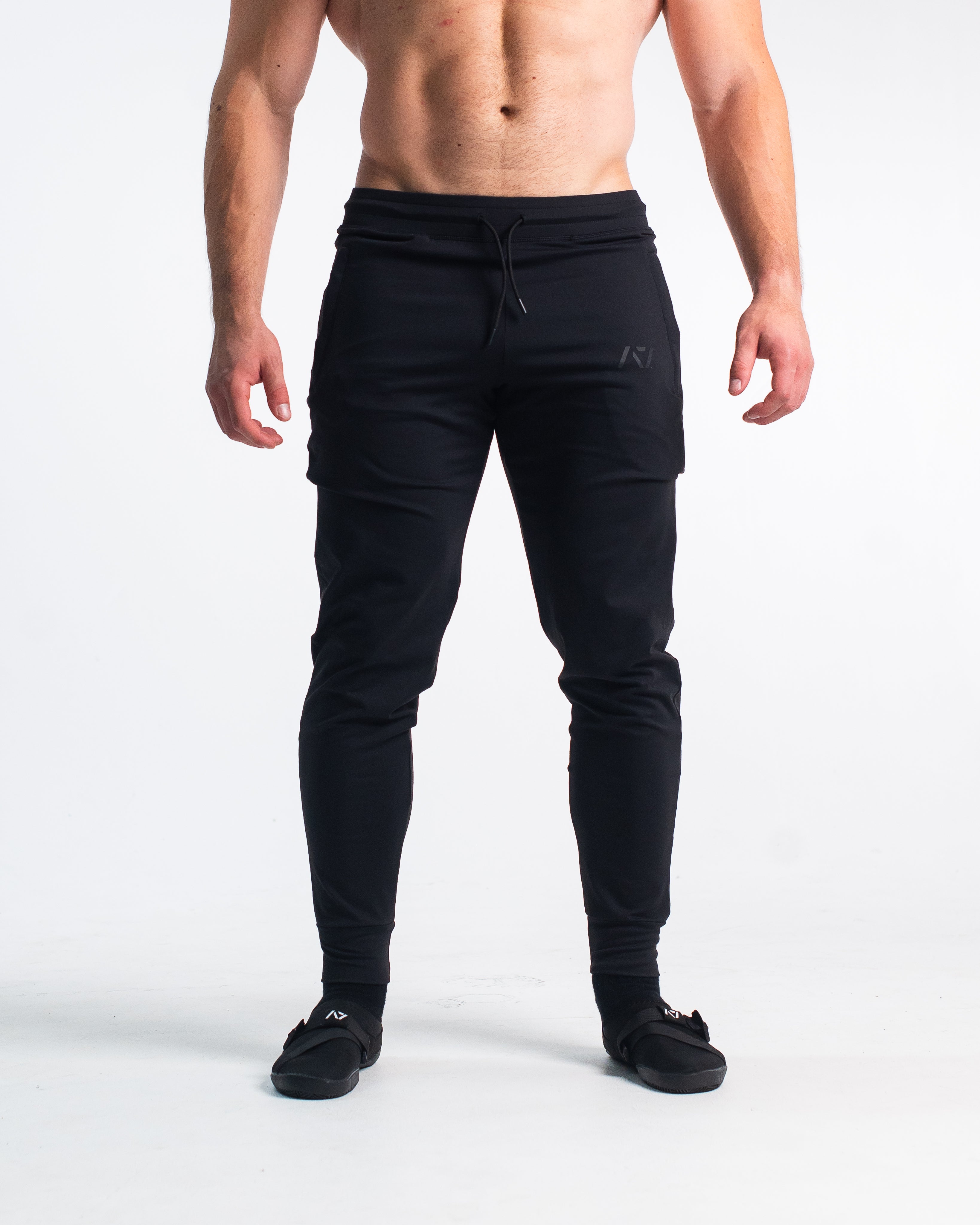 front.jpg Front view of Stealth Defy Joggers showing tapered leg, mid-rise waist, and zippered front pockets.