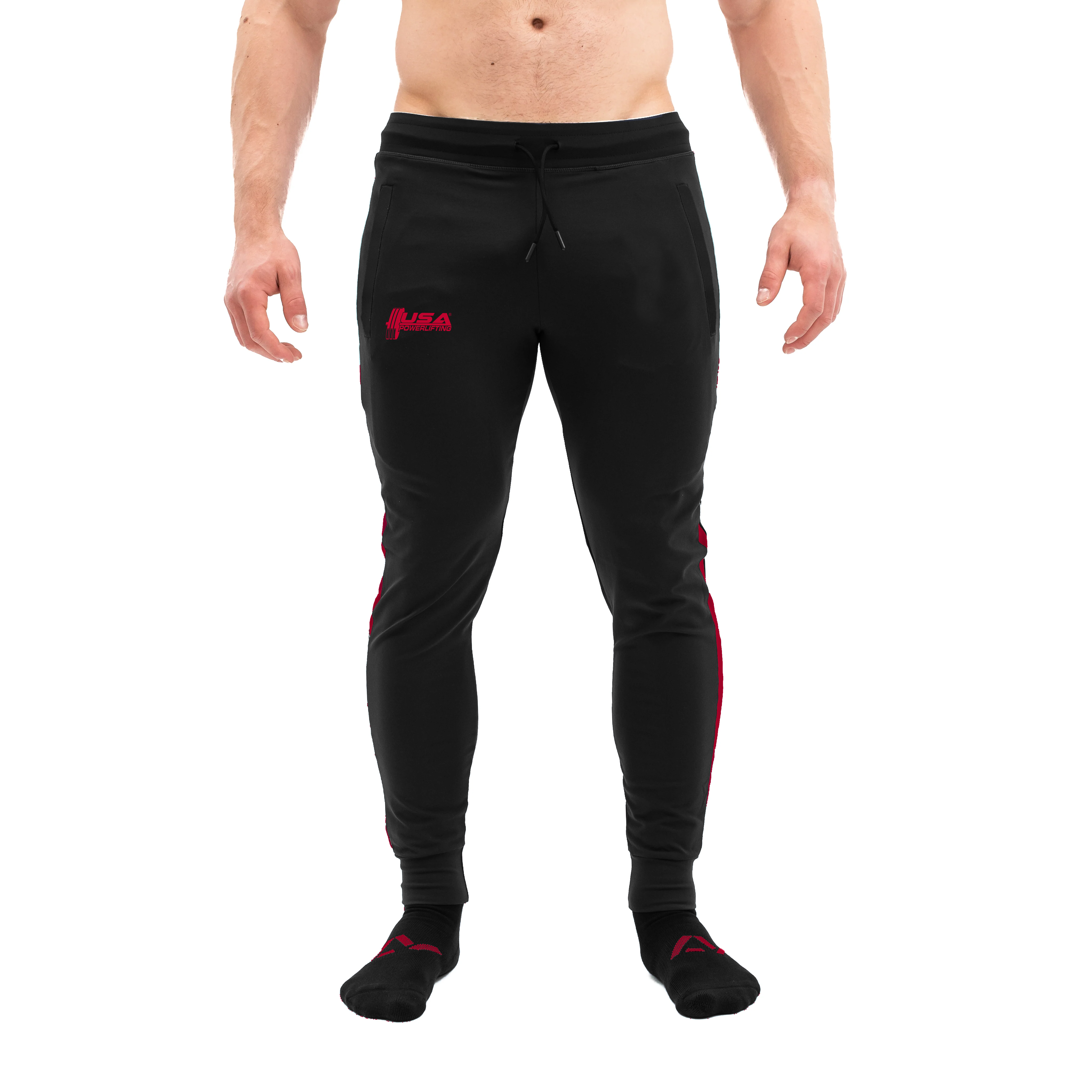 Front view of USAPL Red Defy Joggers showing mid-rise waist, tapered leg, and zippered pockets.