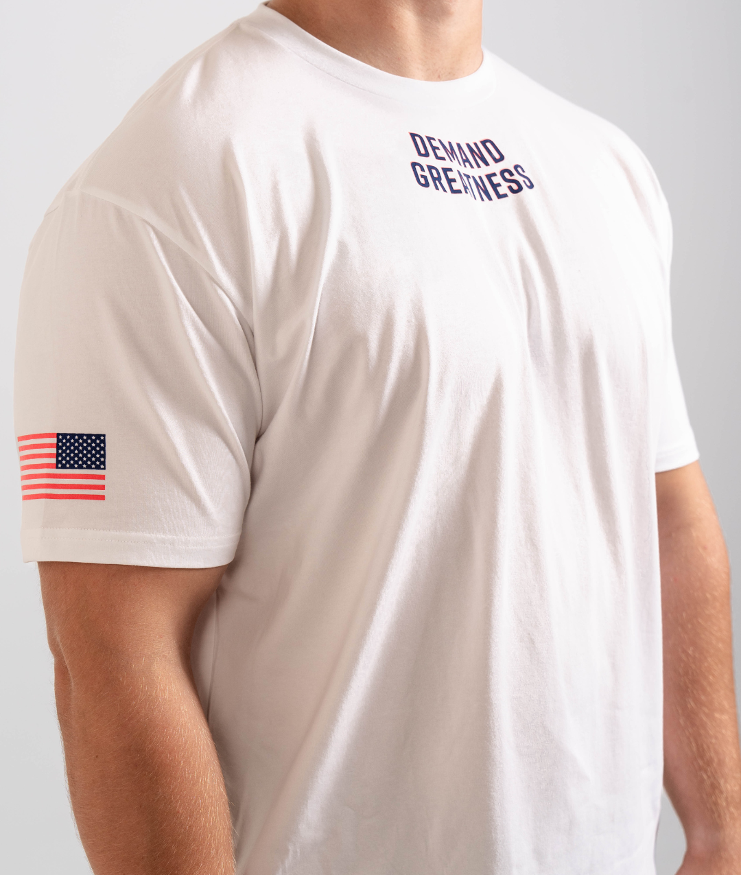 Side view of the Americana True-Fit Meet Shirt highlighting the printed American flag on the sleeve and athletic tapered fit through the torso.