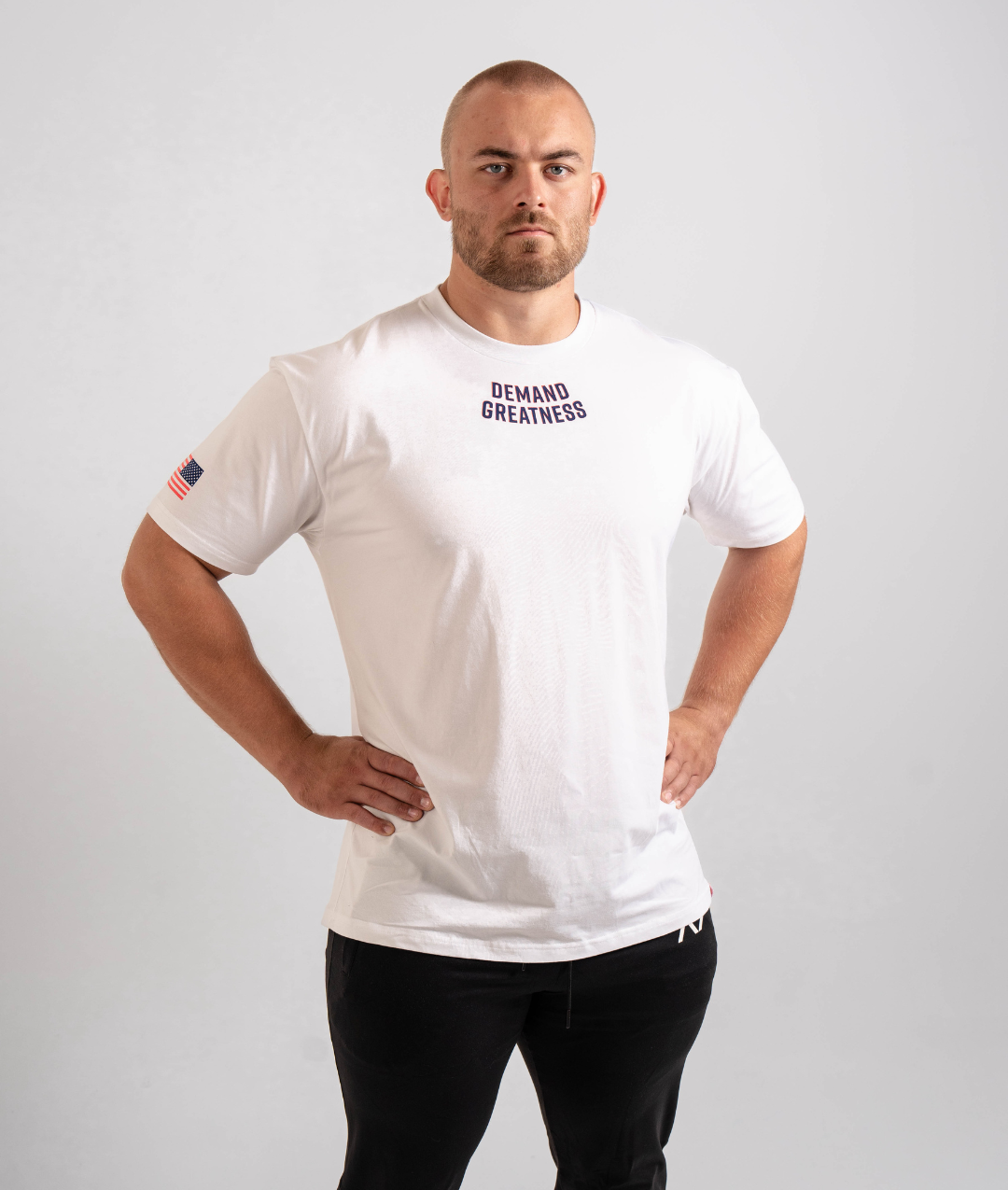 Front view of the Americana True‑Fit Meet Shirt showing “Demand Greatness” chest print.