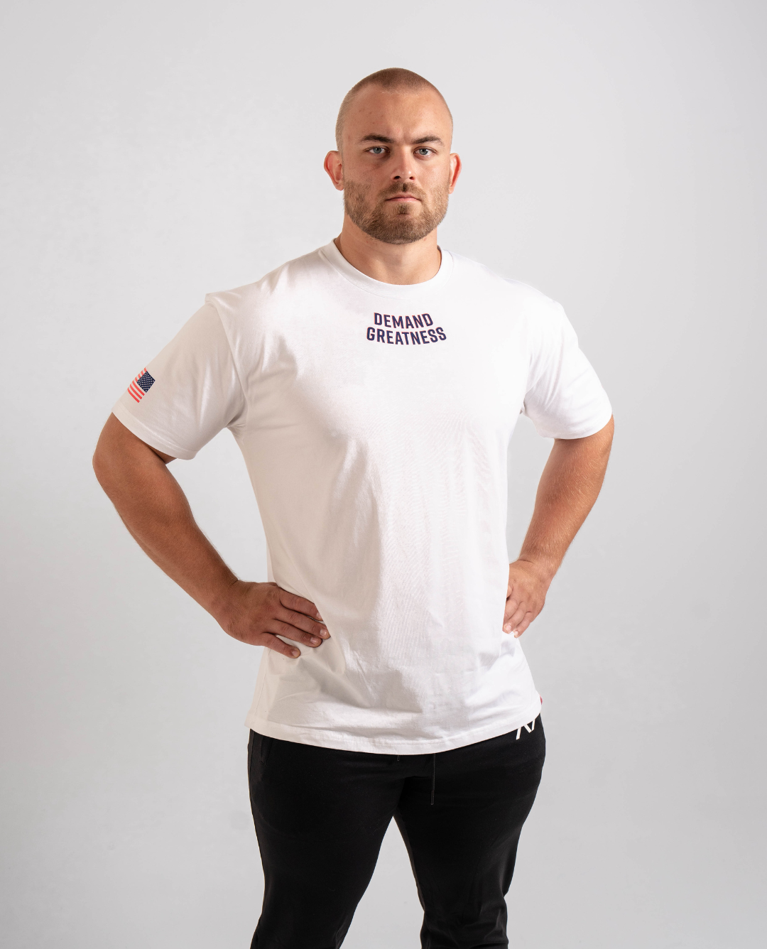 Front view of the Americana True‑Fit Meet Shirt showing “Demand Greatness” chest print.