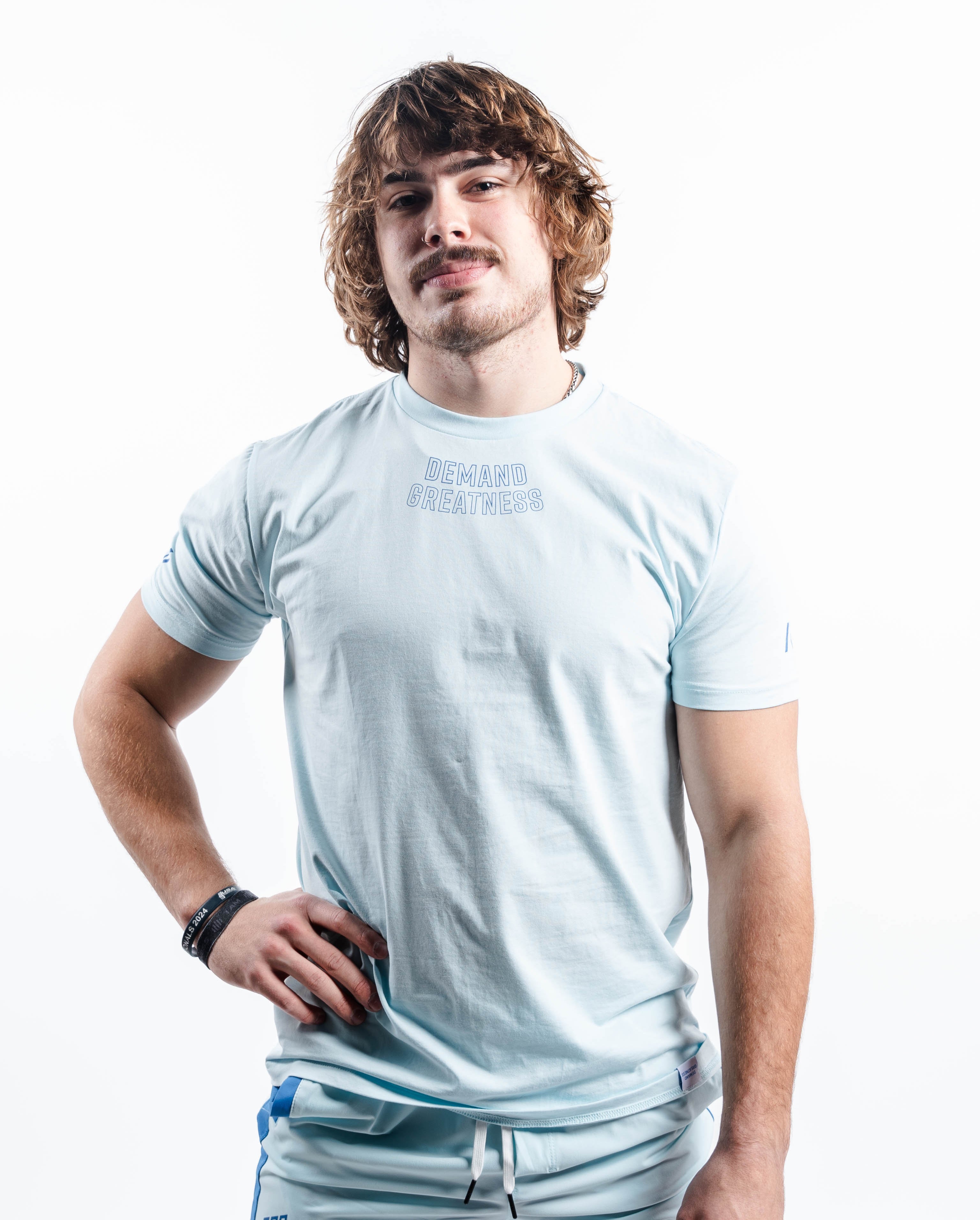 Front view of the Cyanite True‑Fit Meet Shirt showcasing “Demand Greatness” print and clean torso fit.