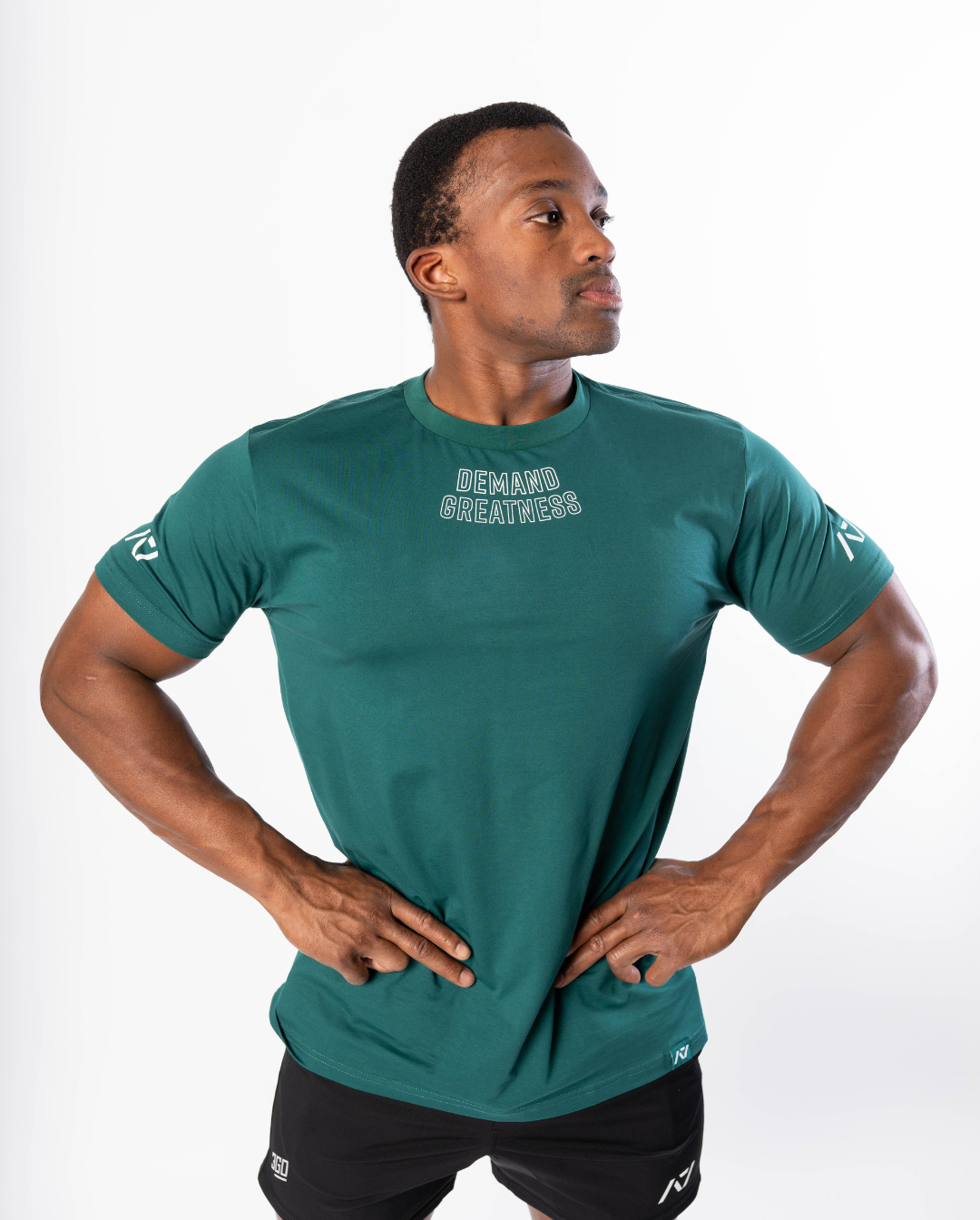 Front view of the Emerald Forás True‑Fit Meet Shirt showing “Demand Greatness” chest print and trimmed fit.