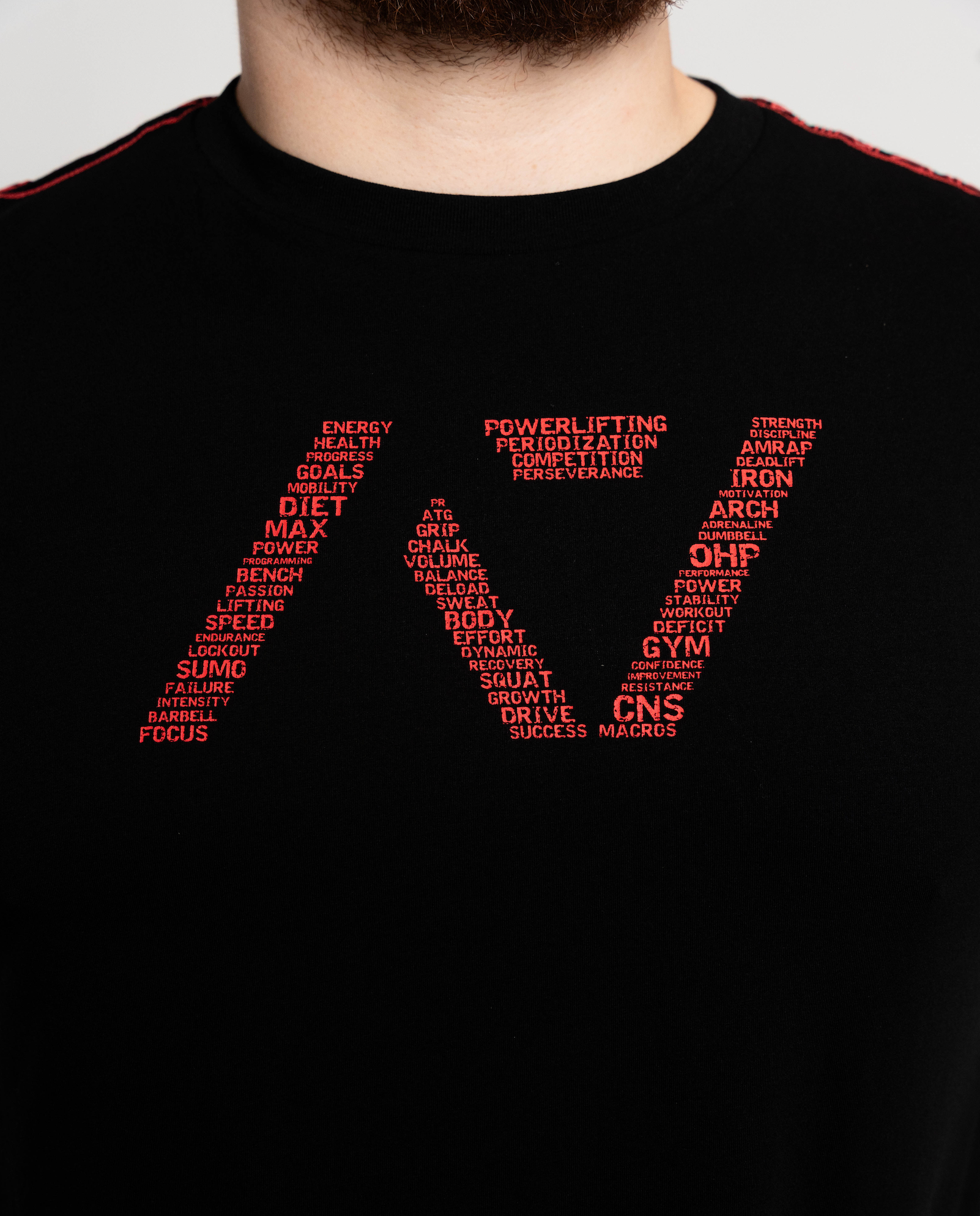 Black t-shirt with red text design on a plain background