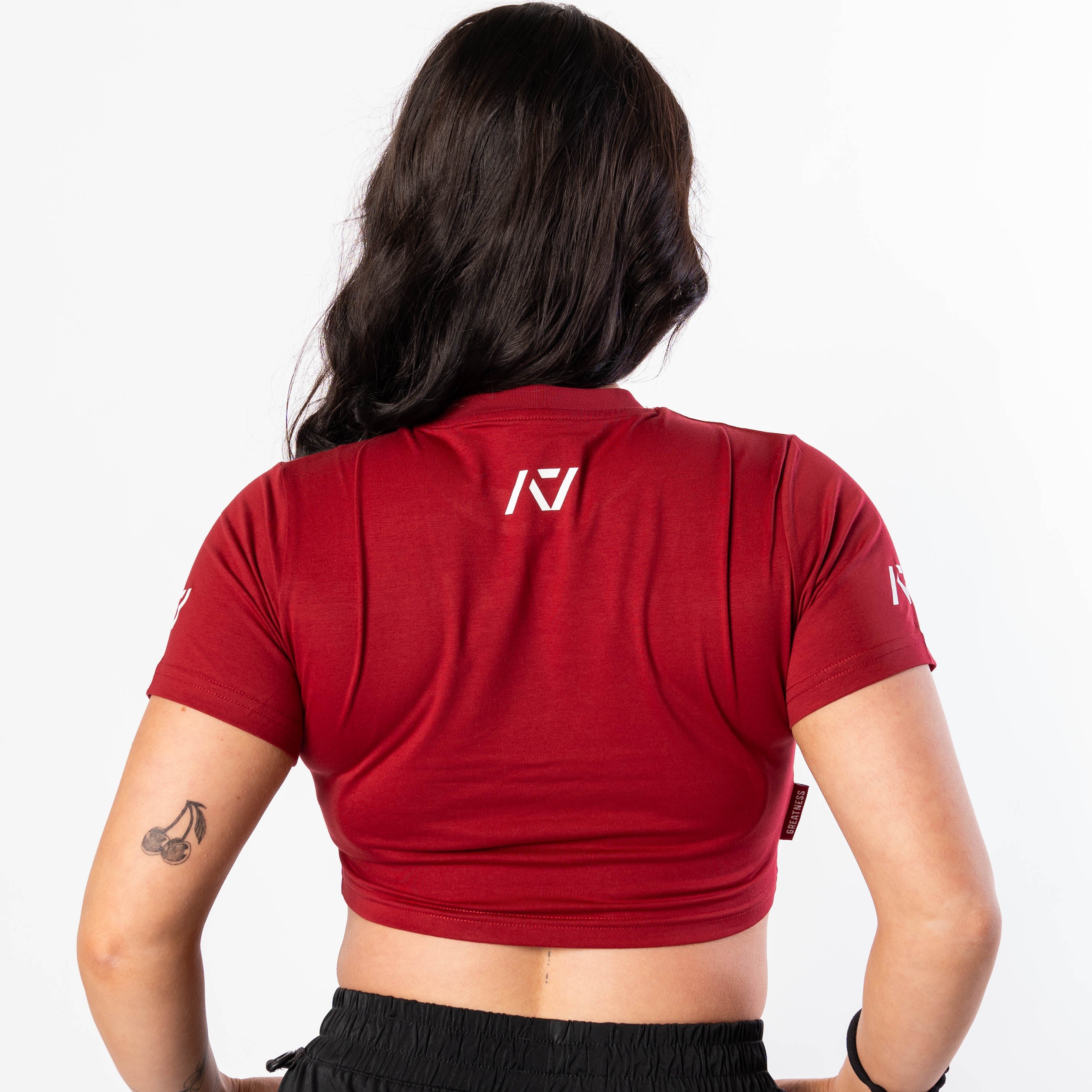 Showcasing back of Ivory Rose Crop Top with A7 logo on upper back