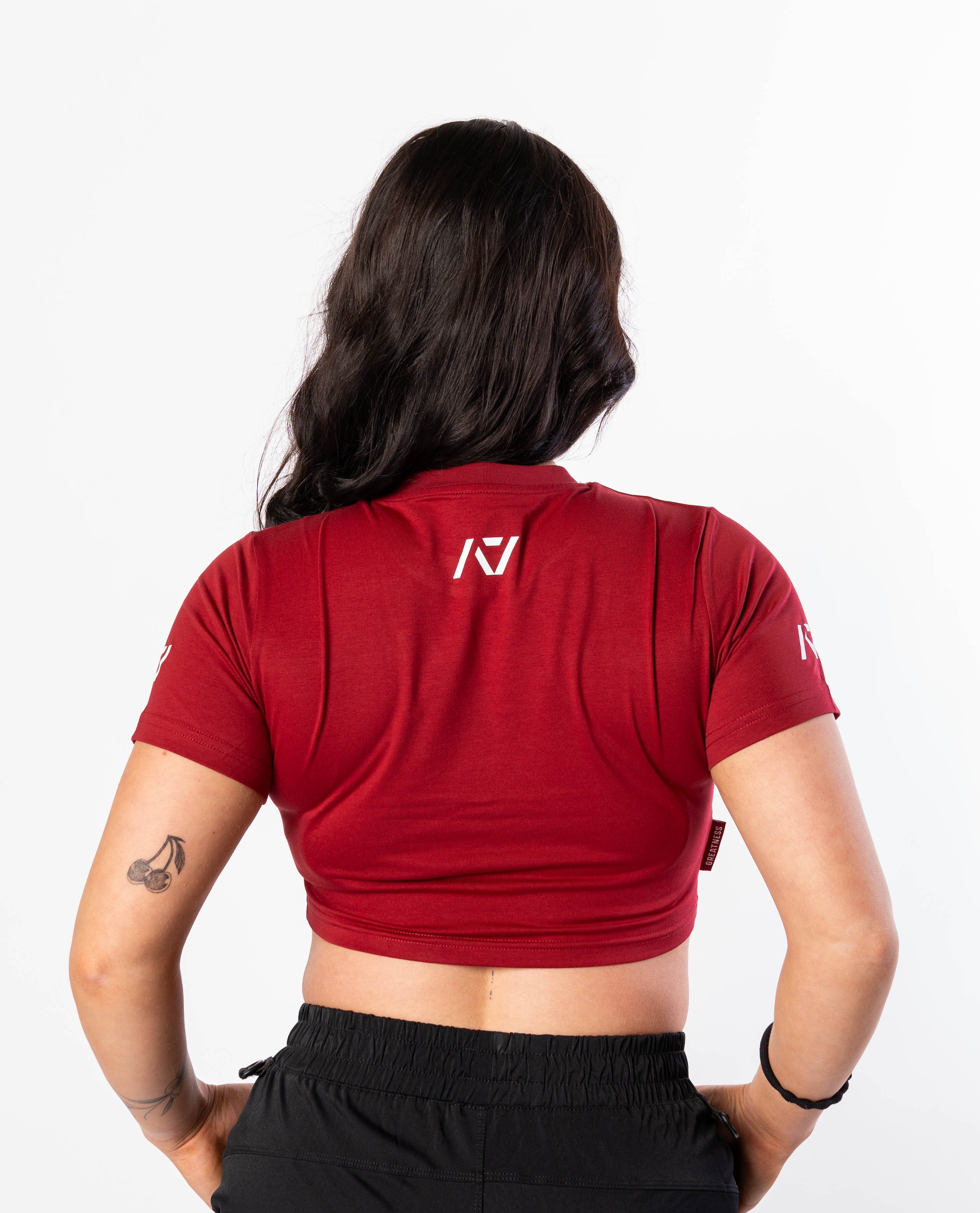 Showcasing back of Ivory Rose Crop Top with A7 logo on upper back