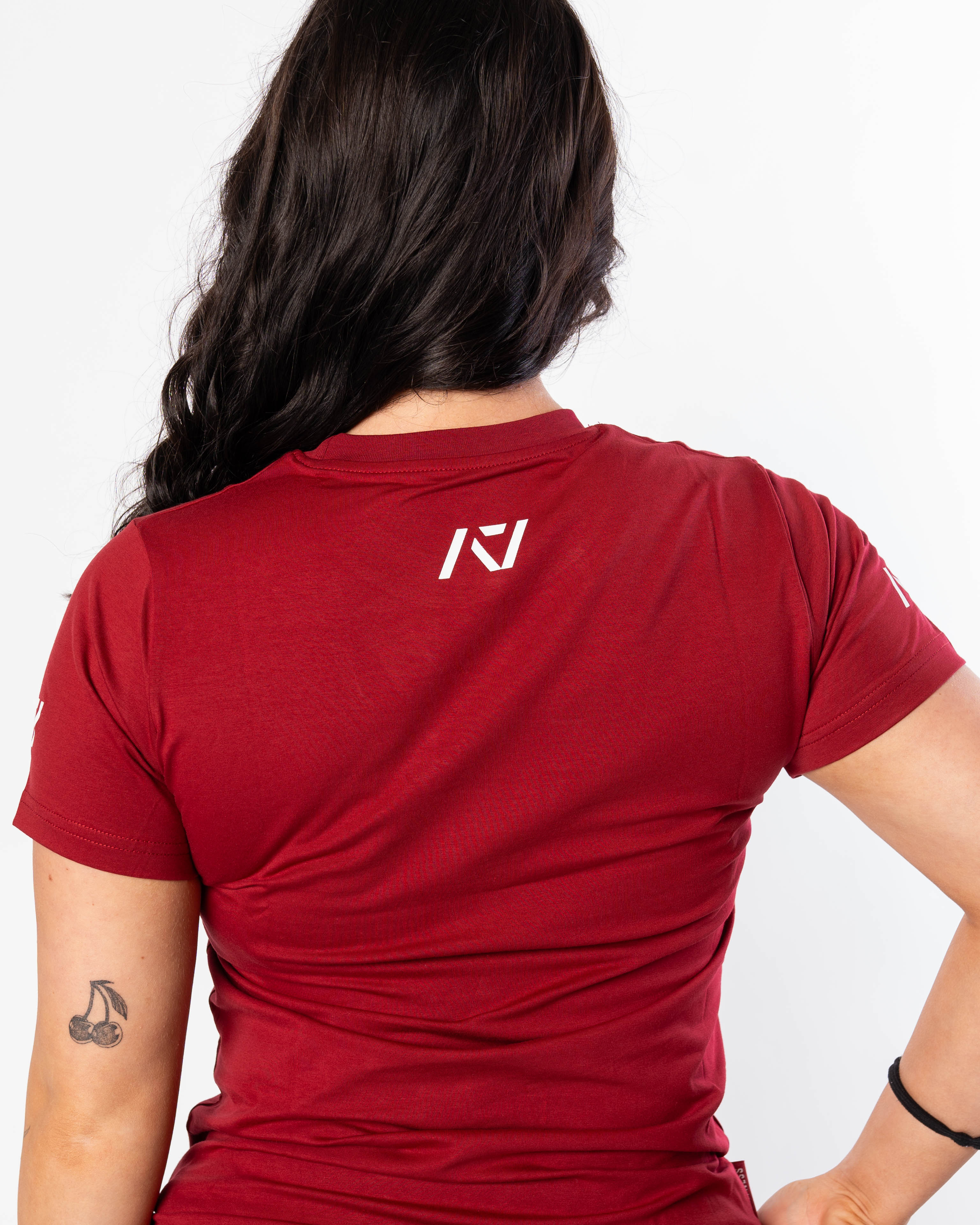 A7 logo on the upper back to show underneath a singlet on red women's meet shirt