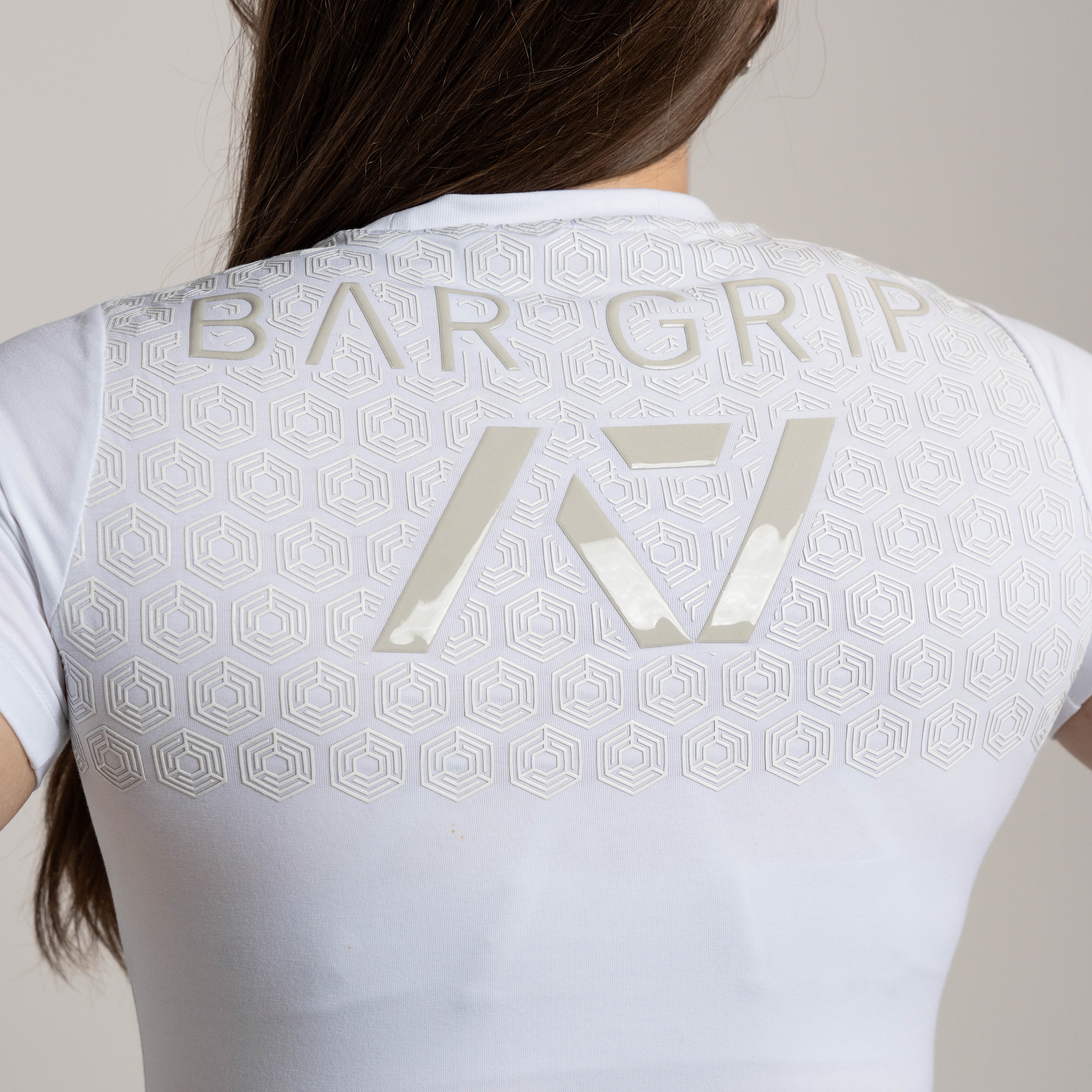 Close up of A7 Bar Grip on kinetic women's bar grip shirt.