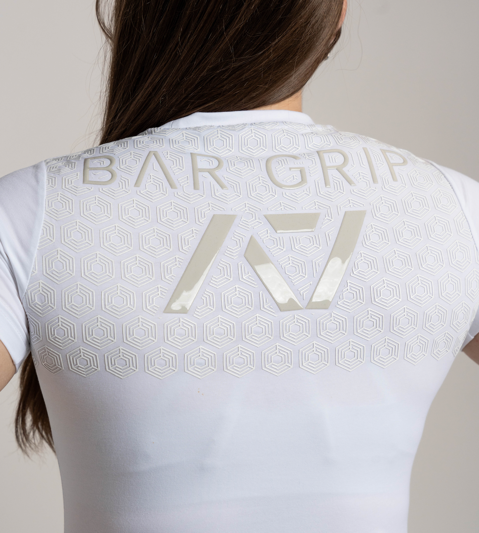 Close up of A7 Bar Grip on kinetic women's bar grip shirt.