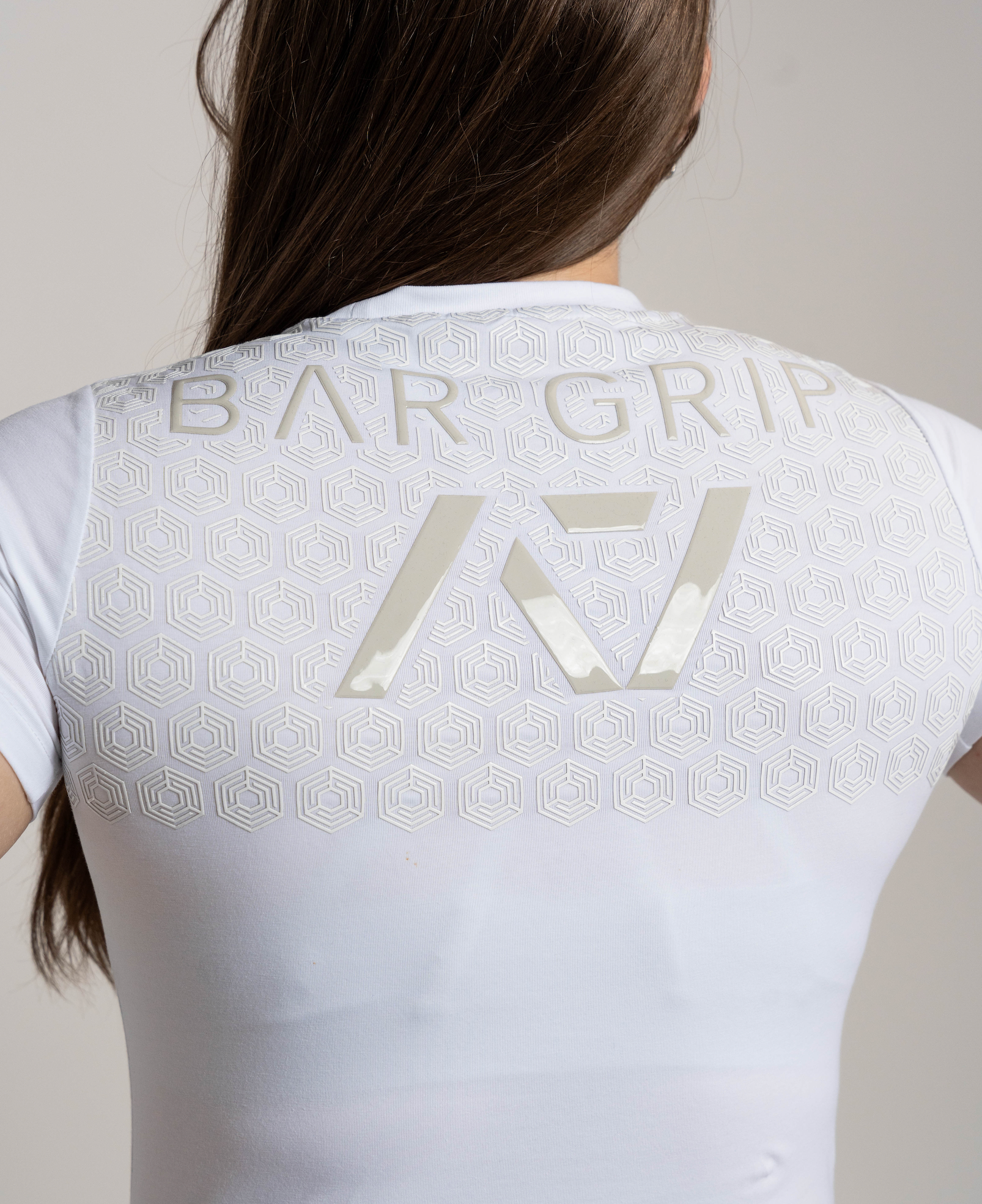 Close up of A7 Bar Grip on kinetic women's bar grip shirt.