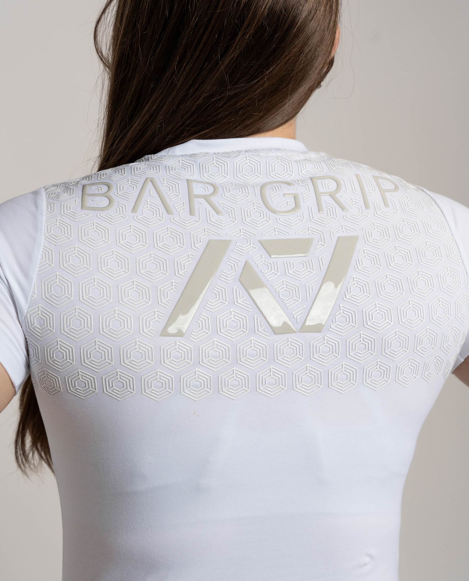 Close up of A7 Bar Grip on kinetic women's bar grip shirt.
