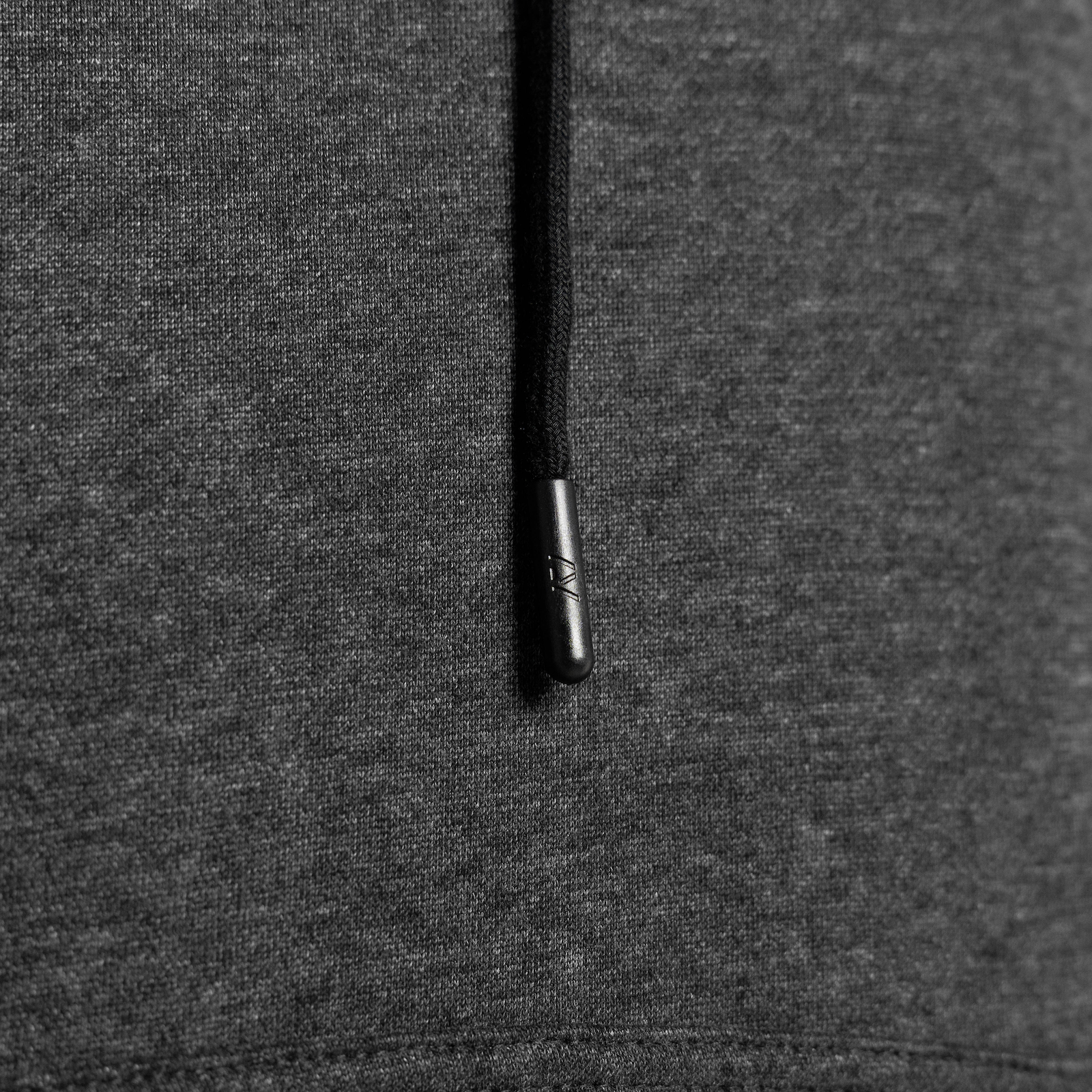 Close-up of a dark gray hoodie draw string