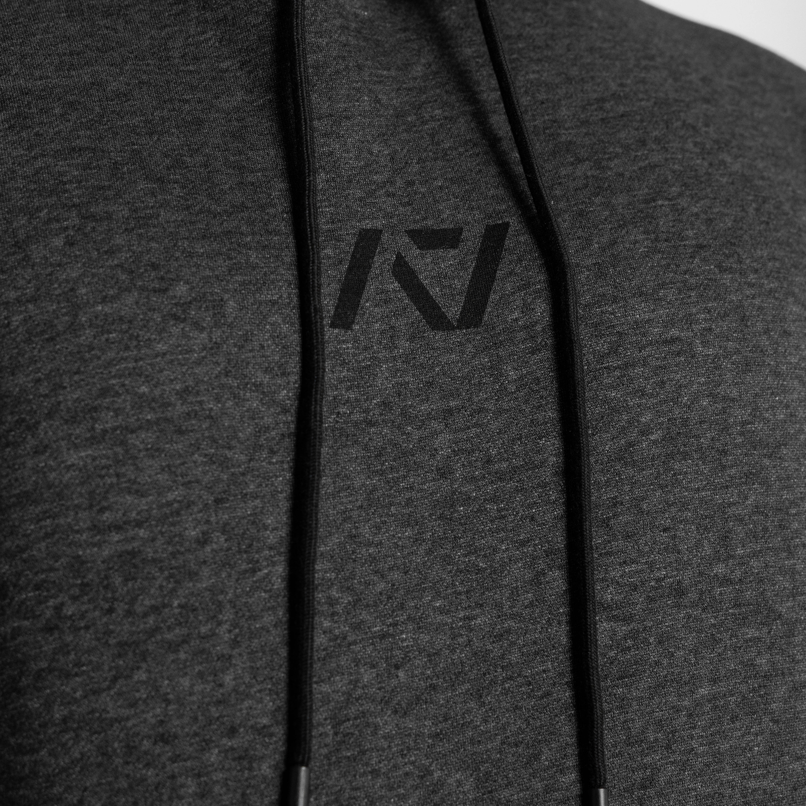 Gray hoodie with a logo on the chest against a white background