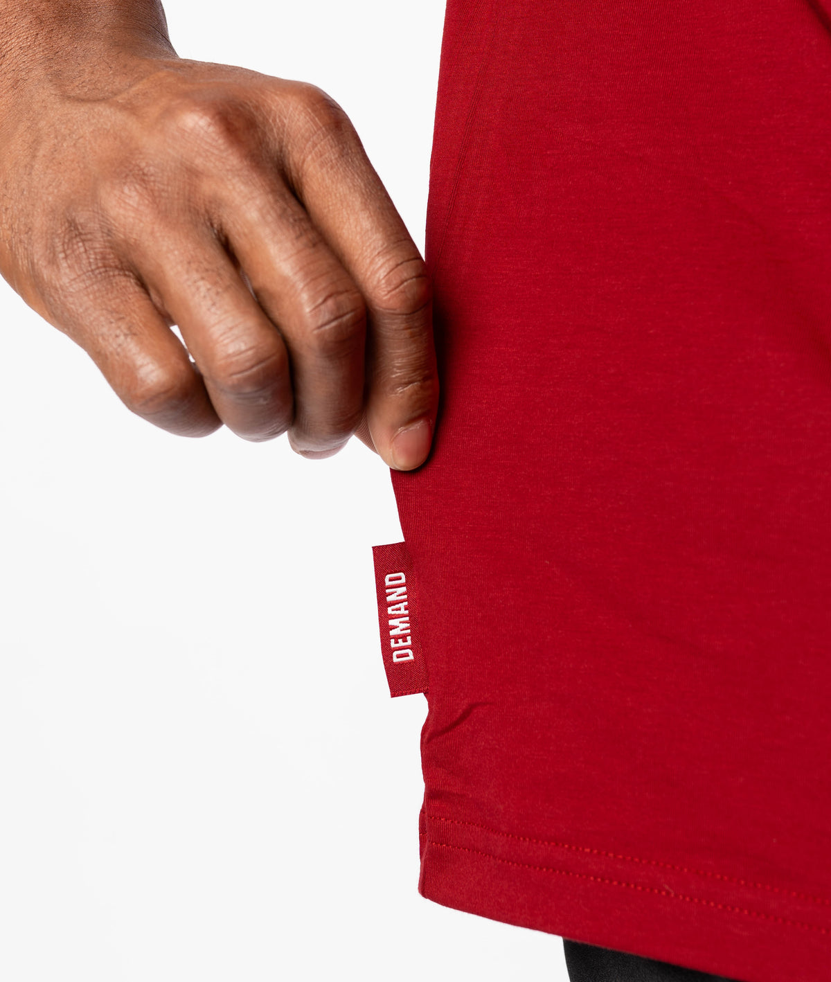 Close up of Demand Greatness side hem tag