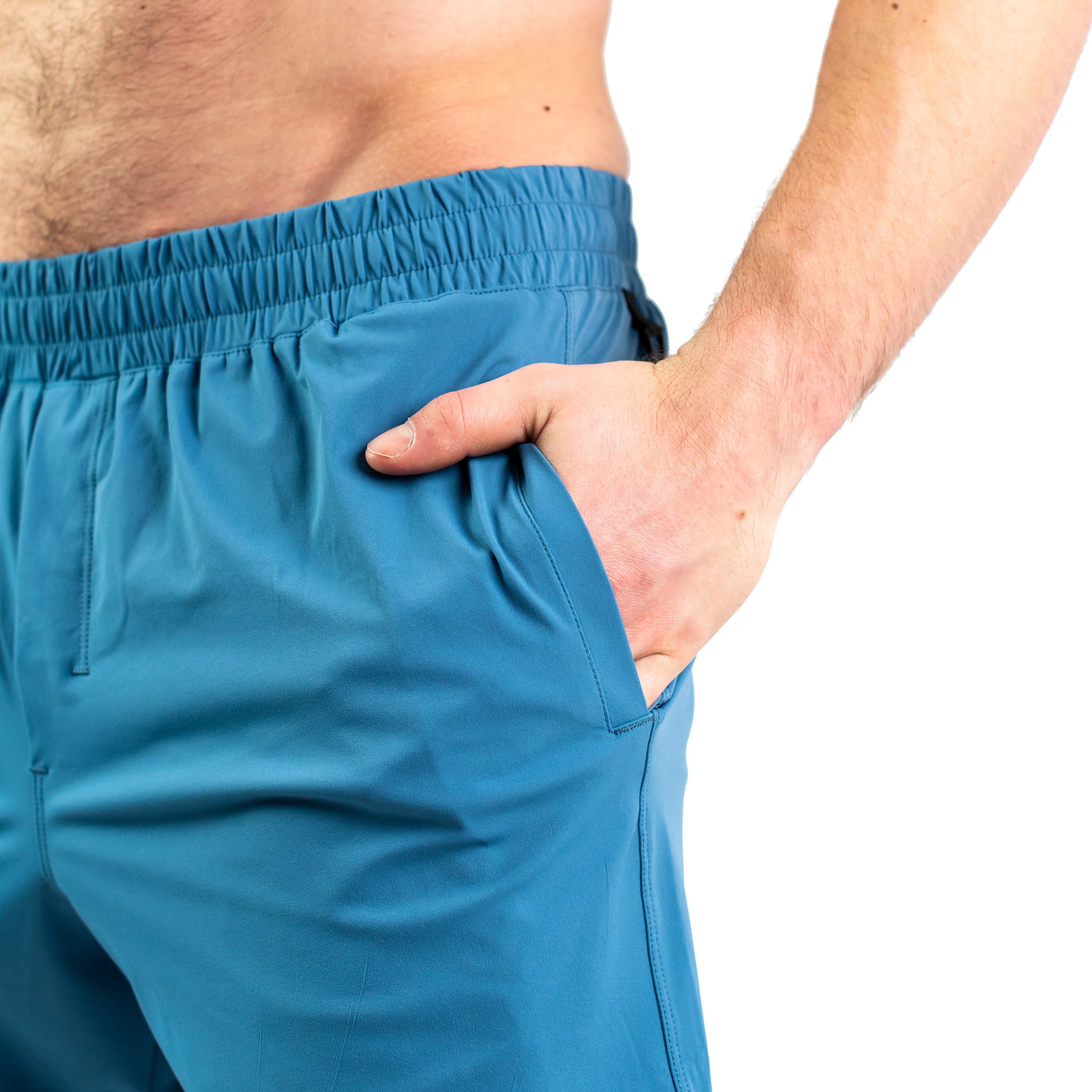 Close-up of ripstop nylon pocket and hidden mini wallet pocket on Honor 360Go Shorts for secure item storage.