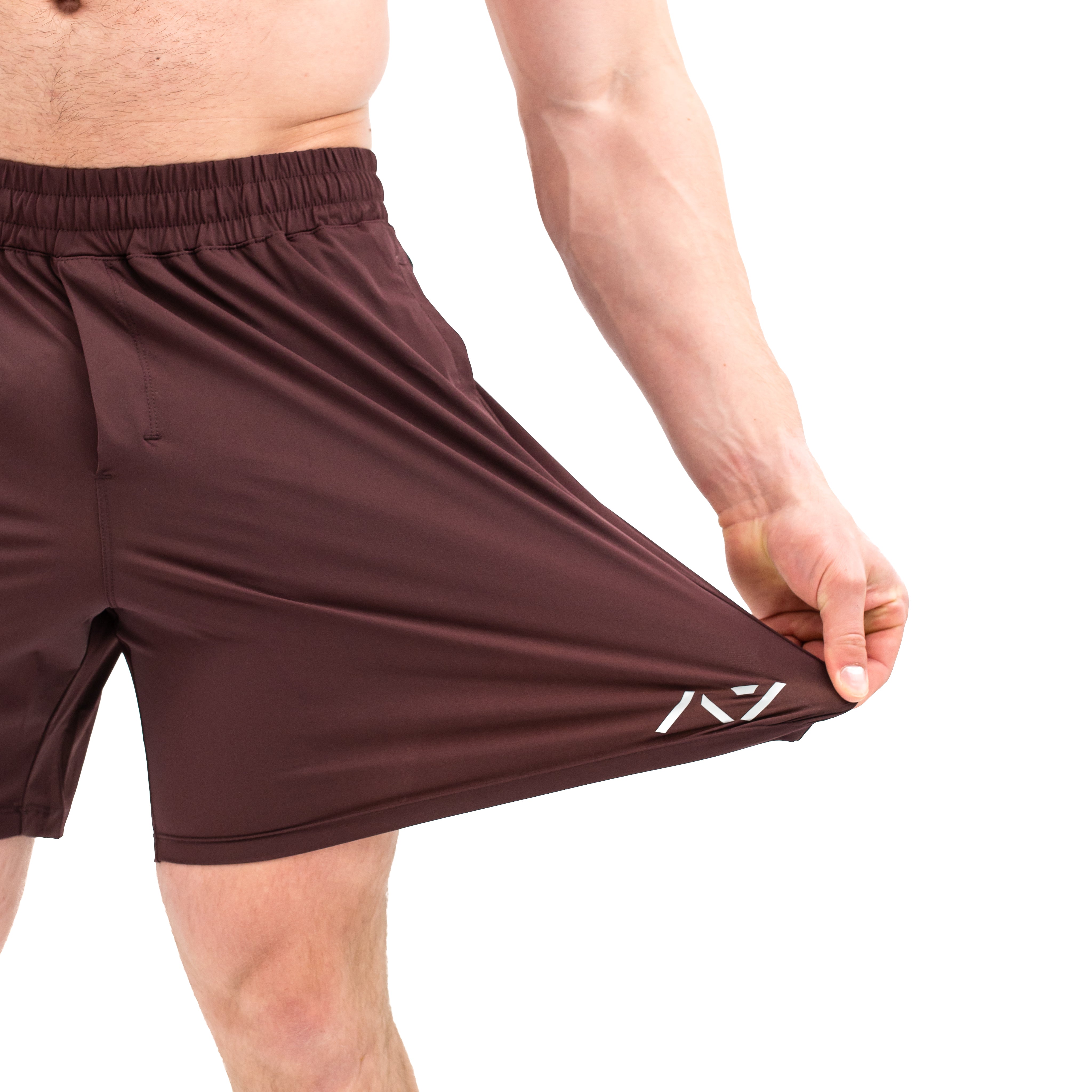 Close-up of 360-degree stretch fabric on Mahogany 360Go Shorts for unrestricted movement during training.