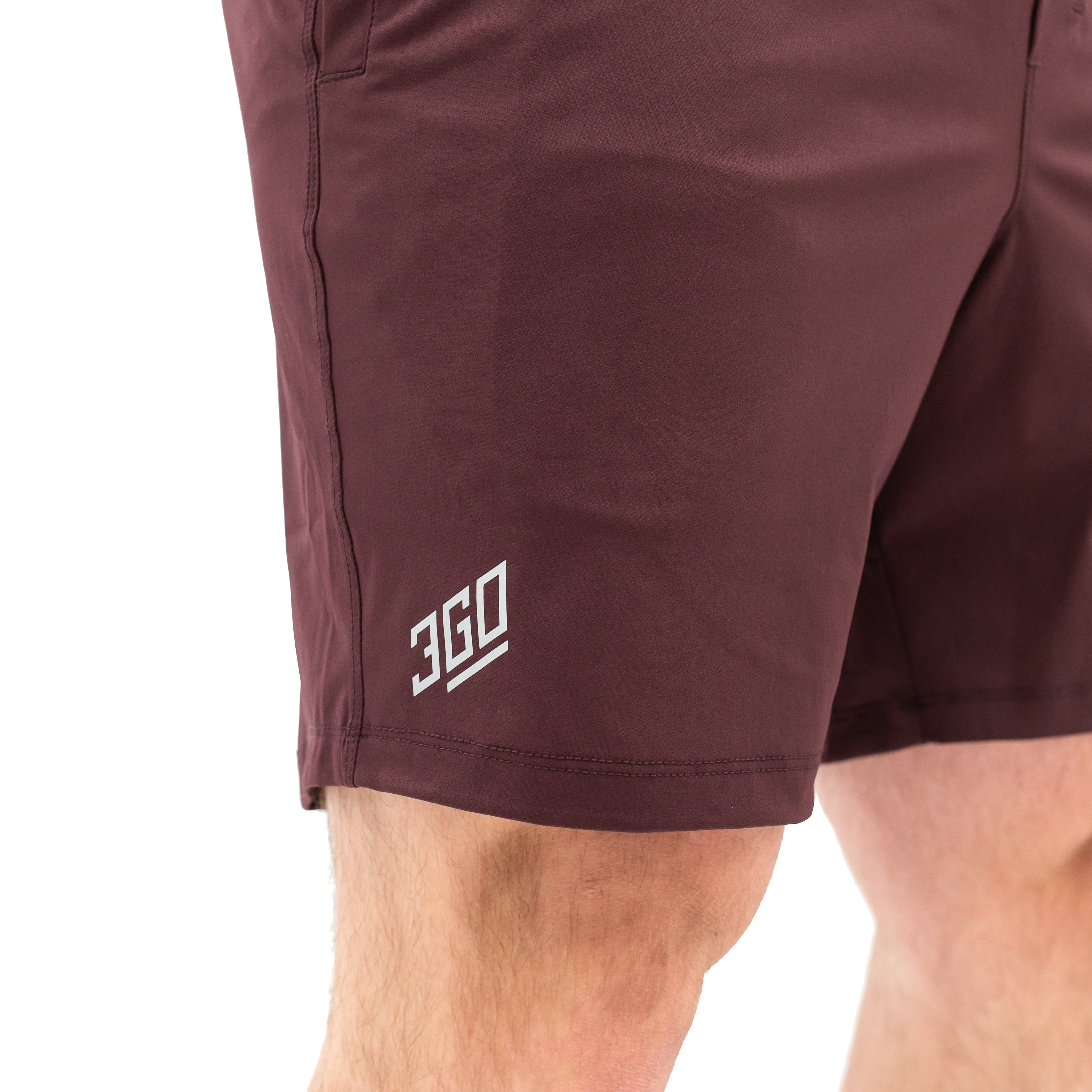 Matte silicone A7 logos on Mahogany 360Go Shorts for subtle, long-lasting branding on a rich red base.