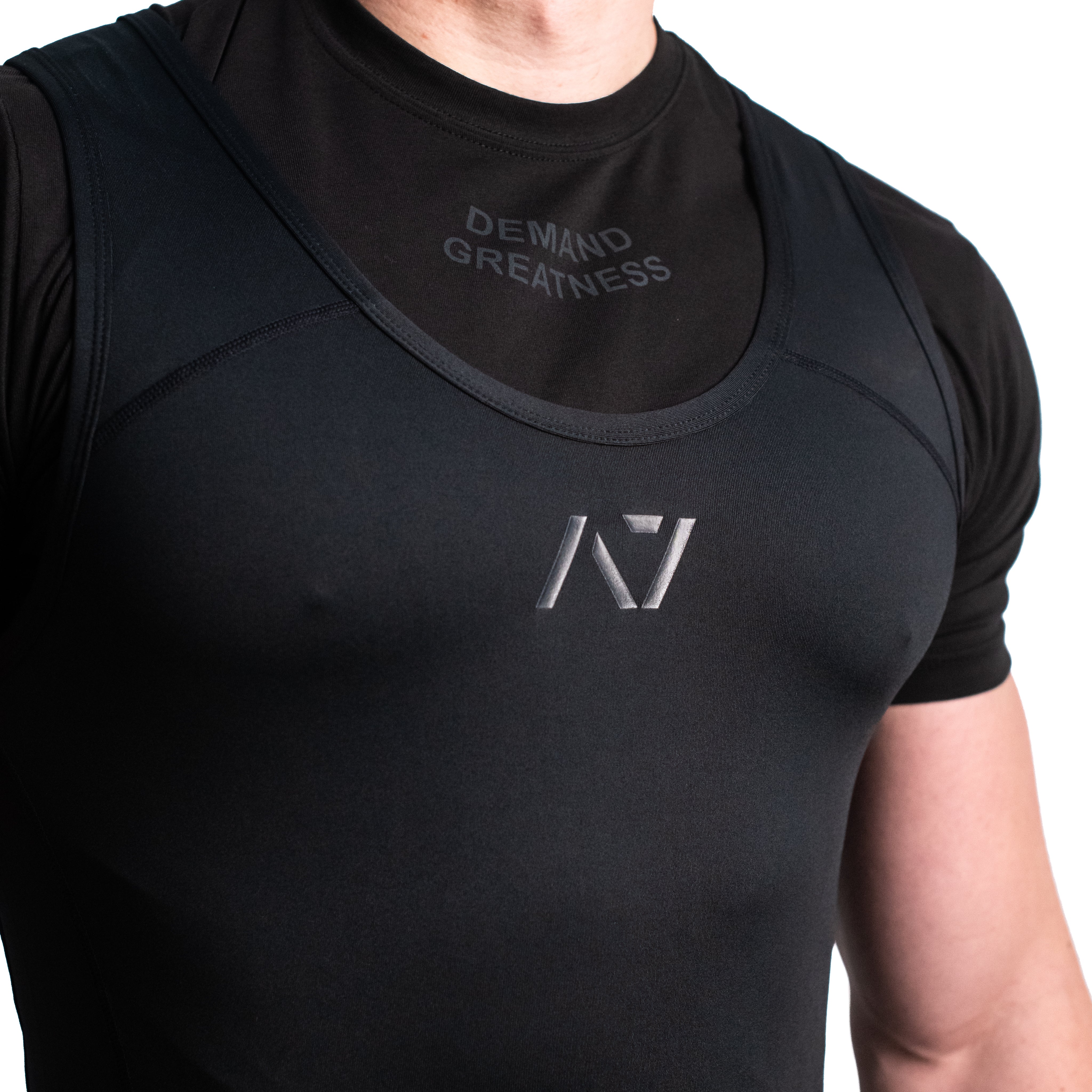 Close-up of tonal A7 logo on the Classic Stealth Singlet, designed for a clean and competition-ready appearance.