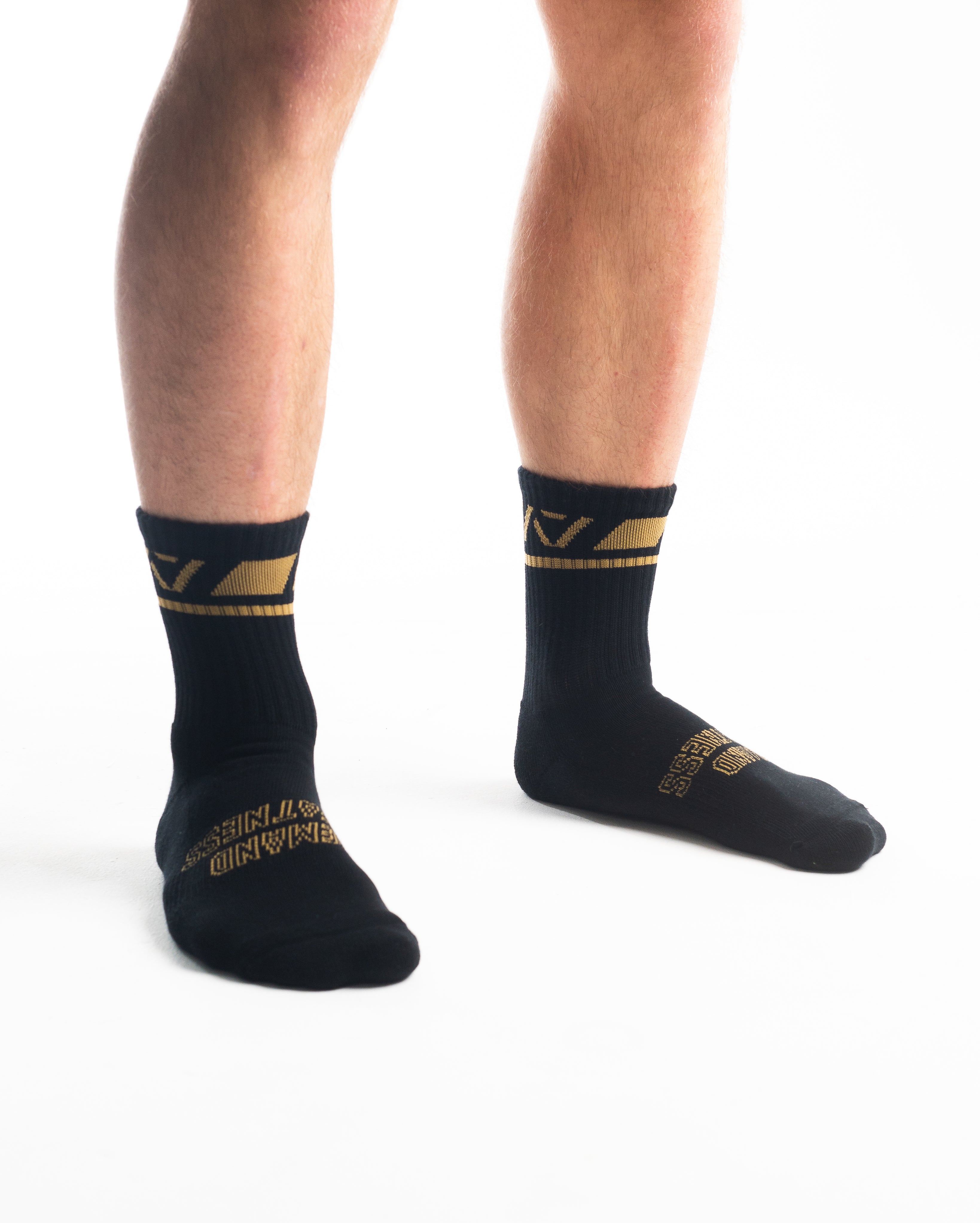 Side profile of A7 Crew Socks in Gold Standard, highlighting the A7 logo on the ankle and compression-style top.