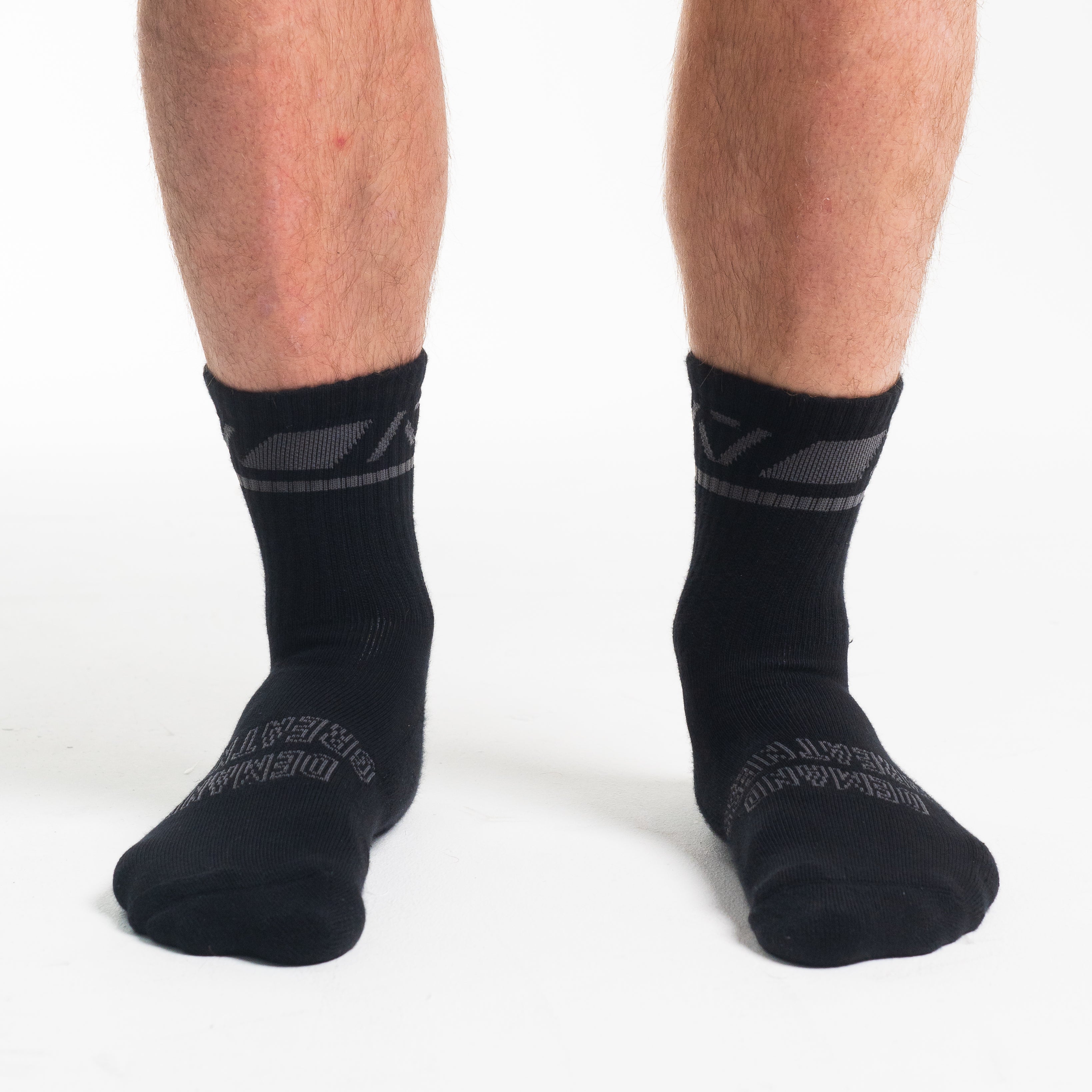 Front view of A7 Crew Socks in Shadow Stone, showcasing mid-shin length and ribbed cuff design.