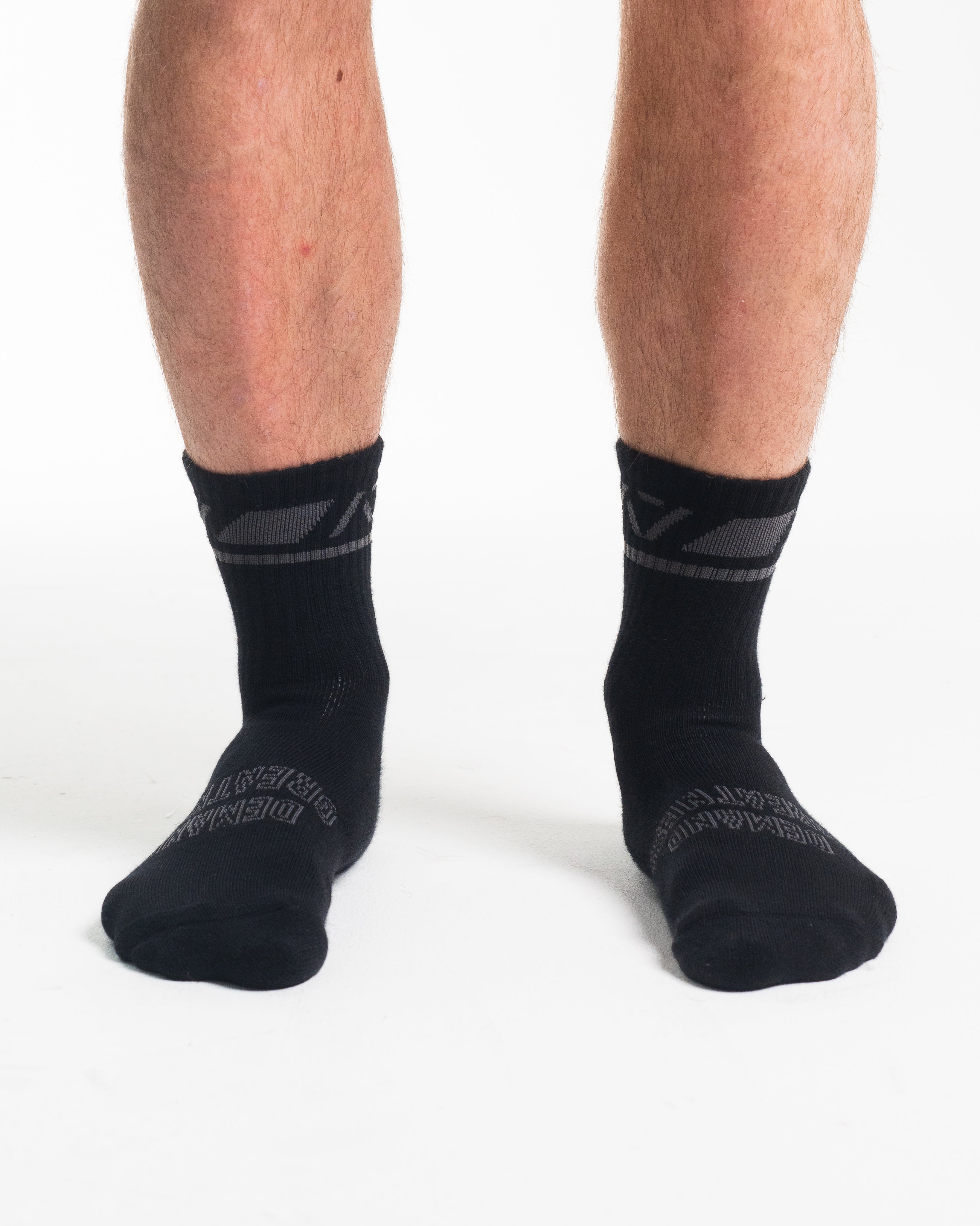 Front view of A7 Crew Socks in Shadow Stone, showcasing mid-shin length and ribbed cuff design.