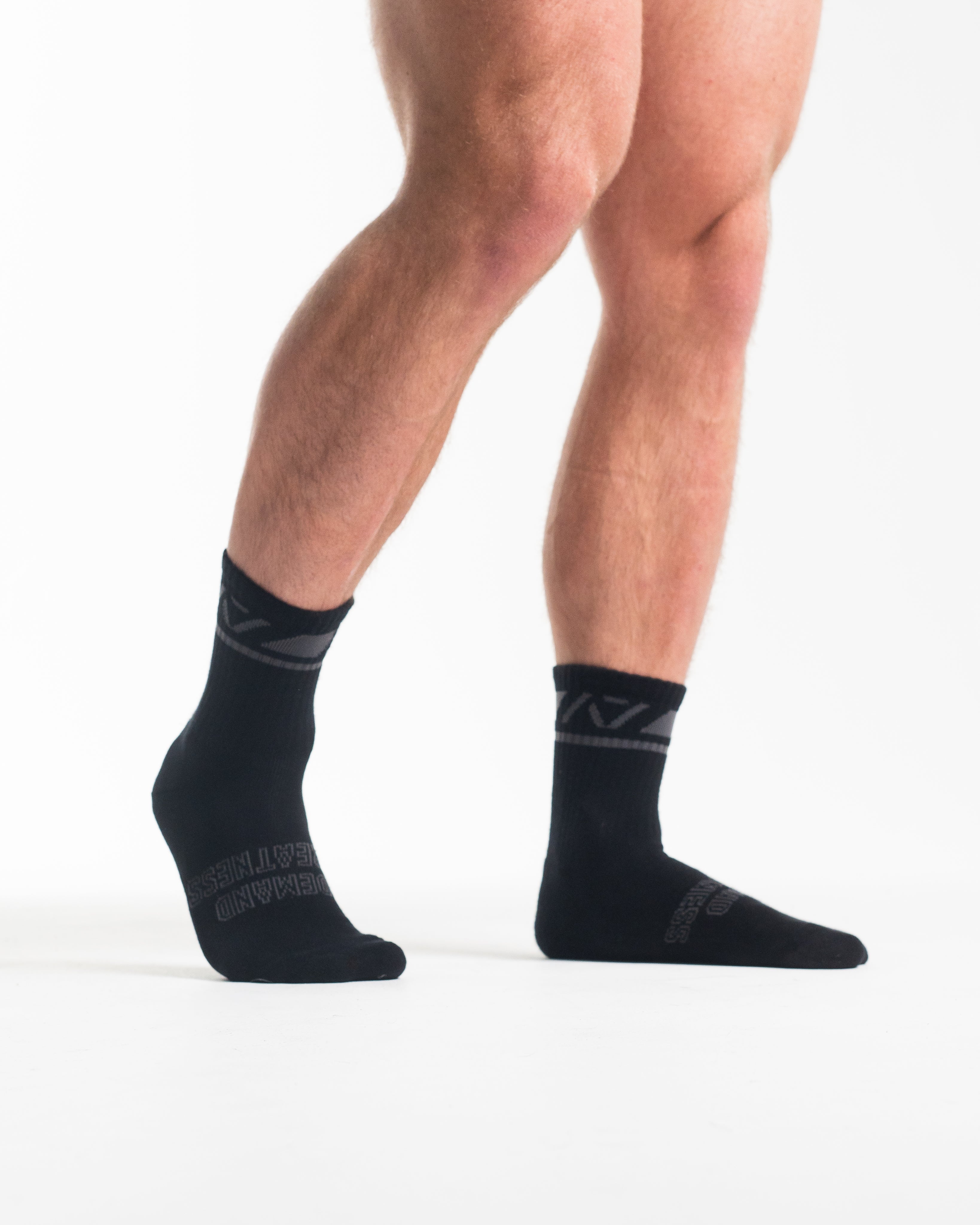 Side profile of A7 Crew Socks in Shadow Stone, highlighting the A7 logo on the ankle and compression-style top.