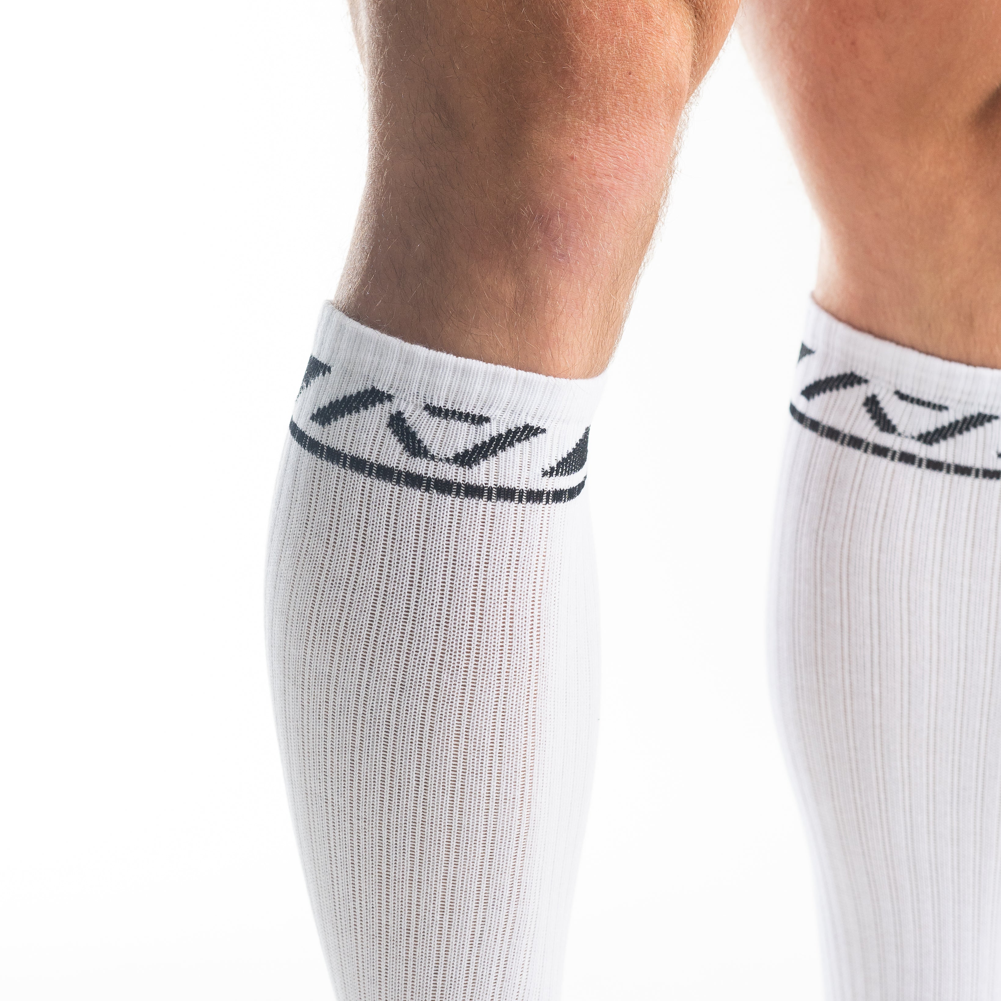 Close-up of the knit fabric on A7 Deadlift Socks in Domino White, showing texture and stitching details.