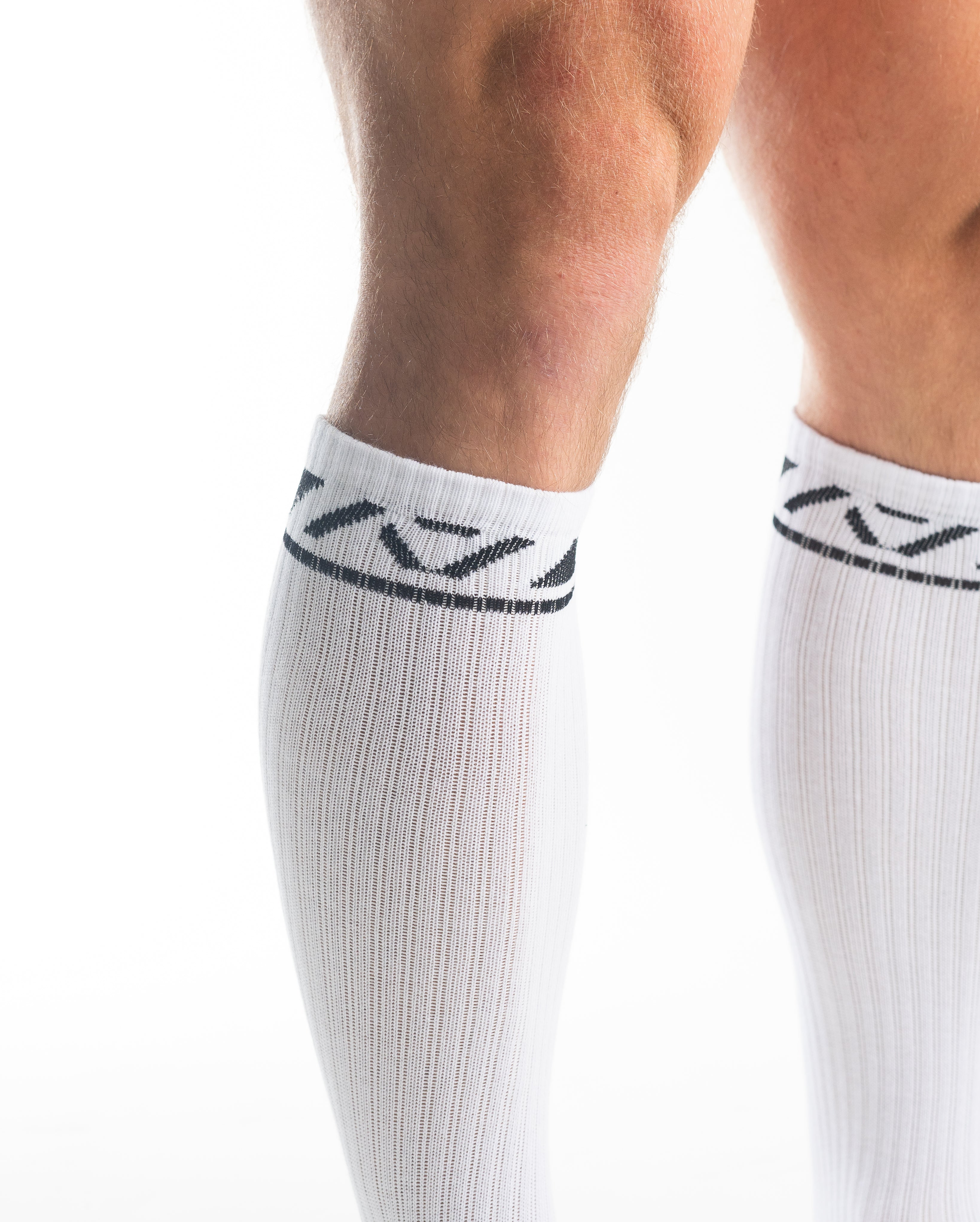 Close-up of the knit fabric on A7 Deadlift Socks in Domino White, showing texture and stitching details.