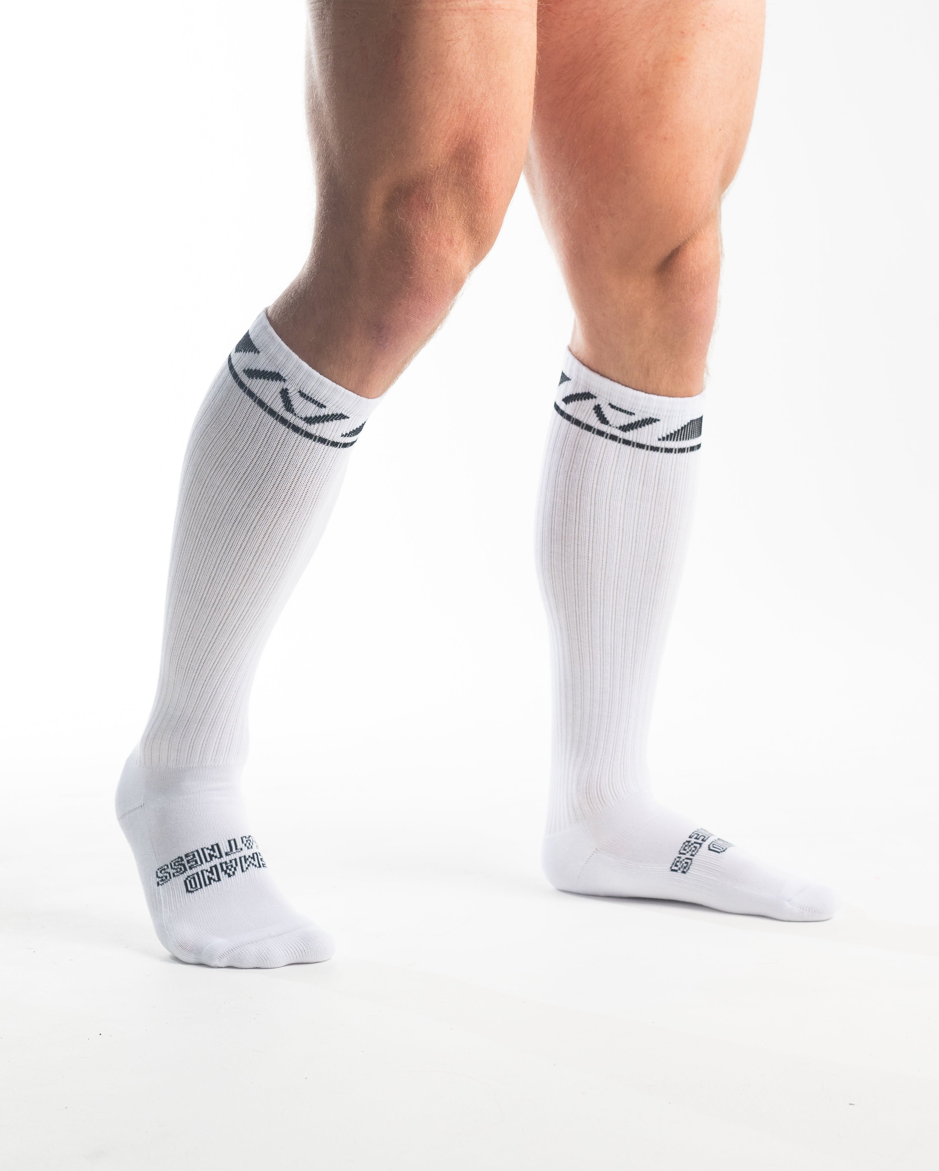 Side profile of A7 Deadlift Socks in Domino White, highlighting the A7 logo on the ankle and compression-style top.
