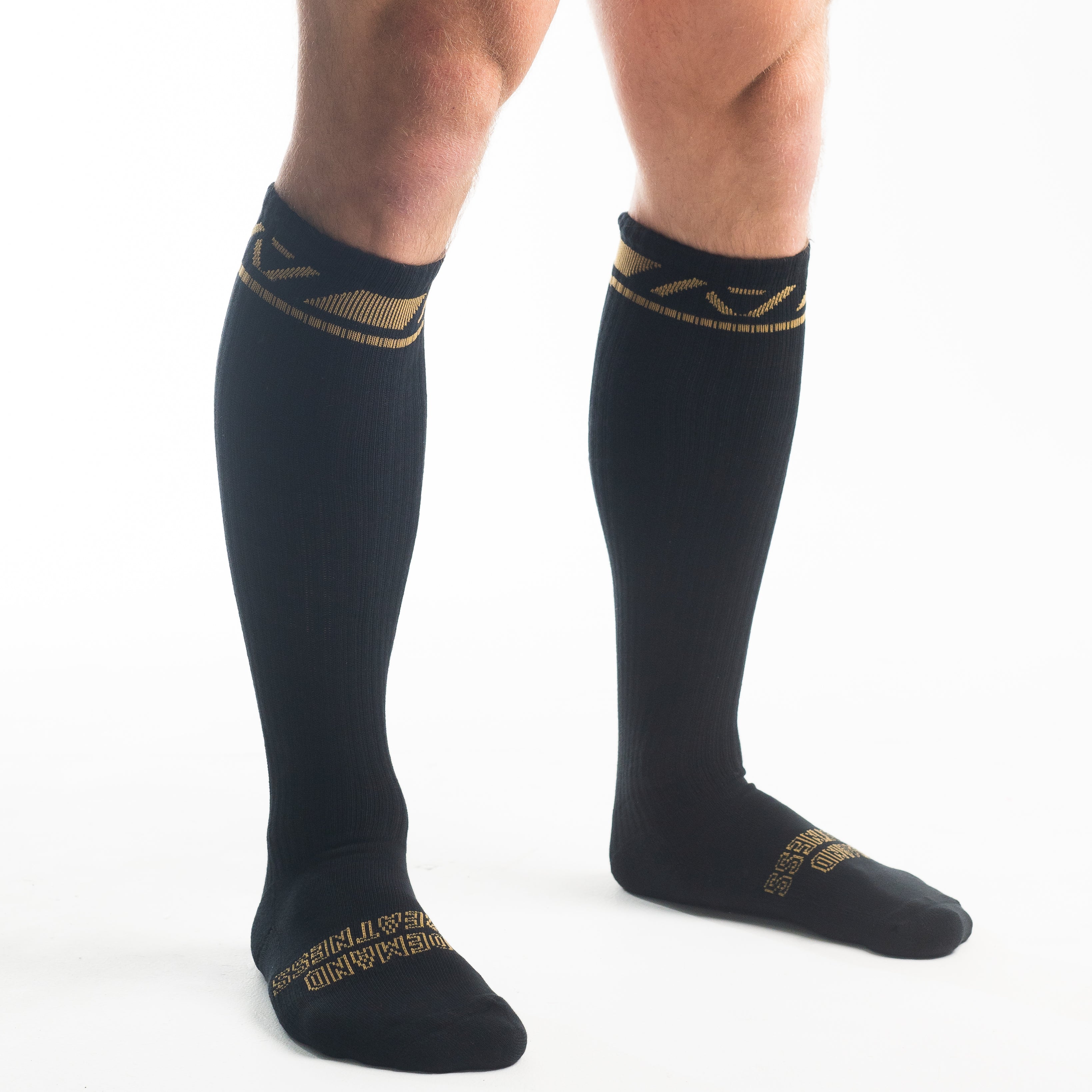 Side profile of A7 Deadlift Socks in Gold Standard, highlighting the A7 logo on the ankle and compression-style top.