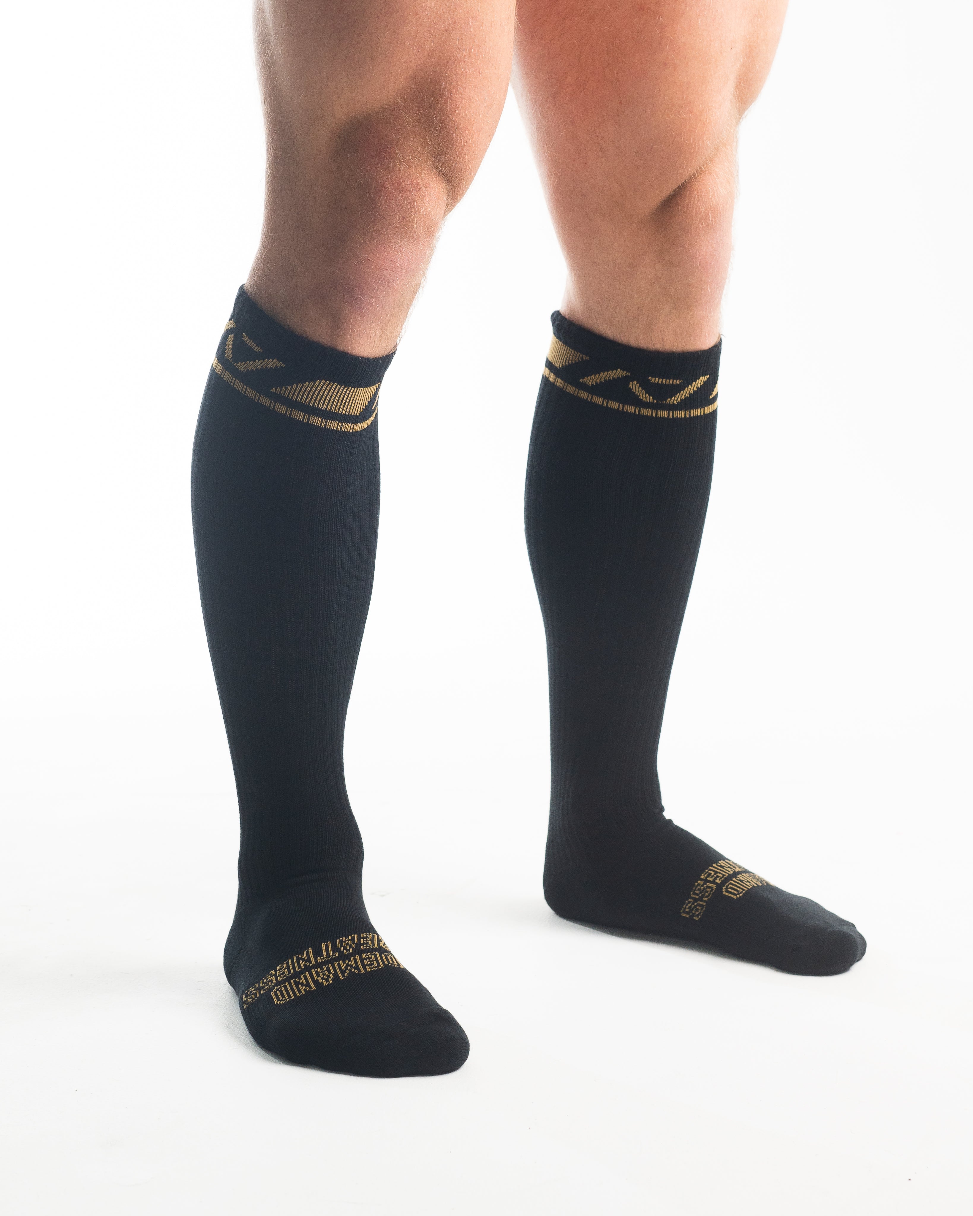 Side profile of A7 Deadlift Socks in Gold Standard, highlighting the A7 logo on the ankle and compression-style top.