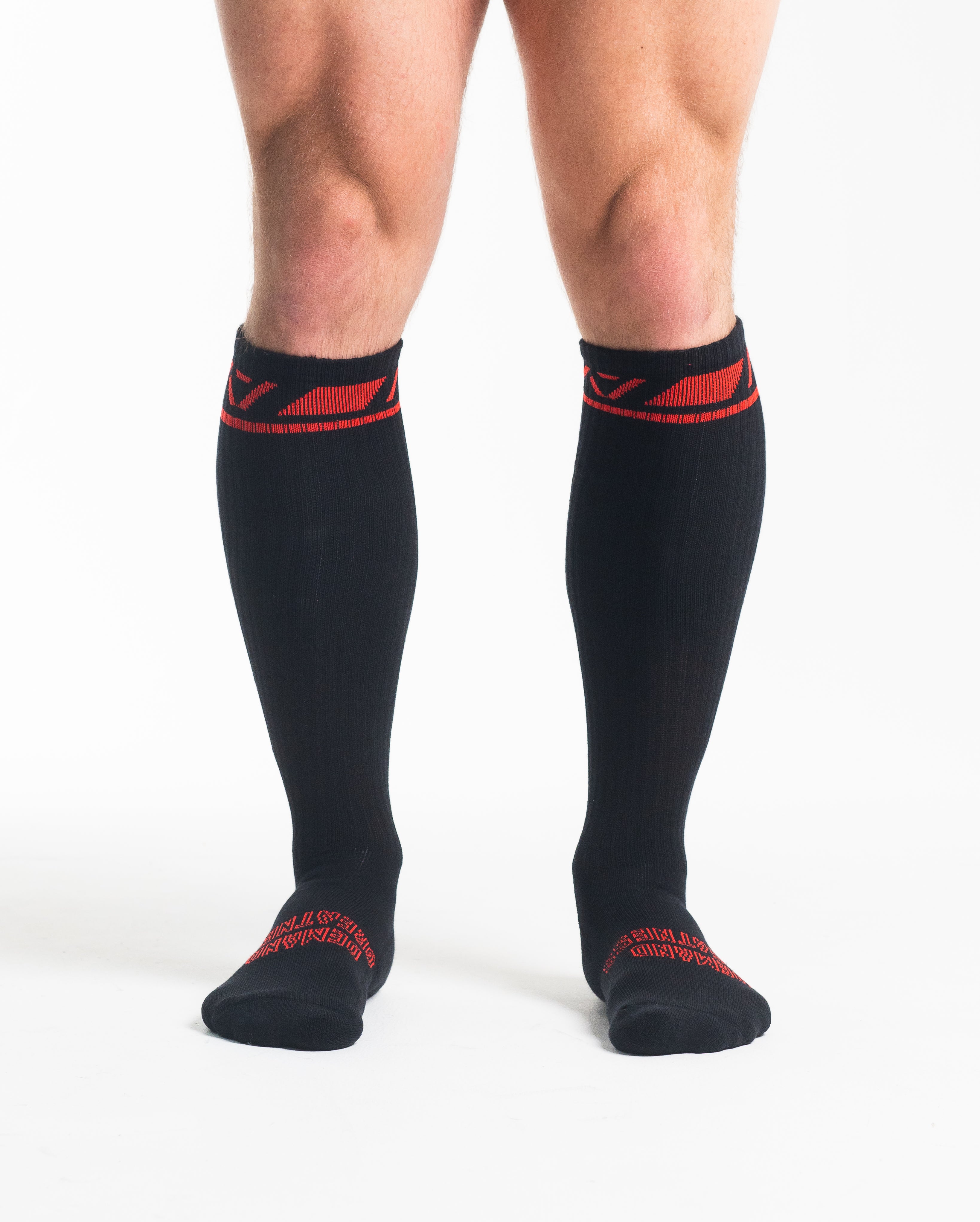 Front view of A7 Deadlift Socks – Red Dawn, displaying knee‑high length and ribbed cuff design.