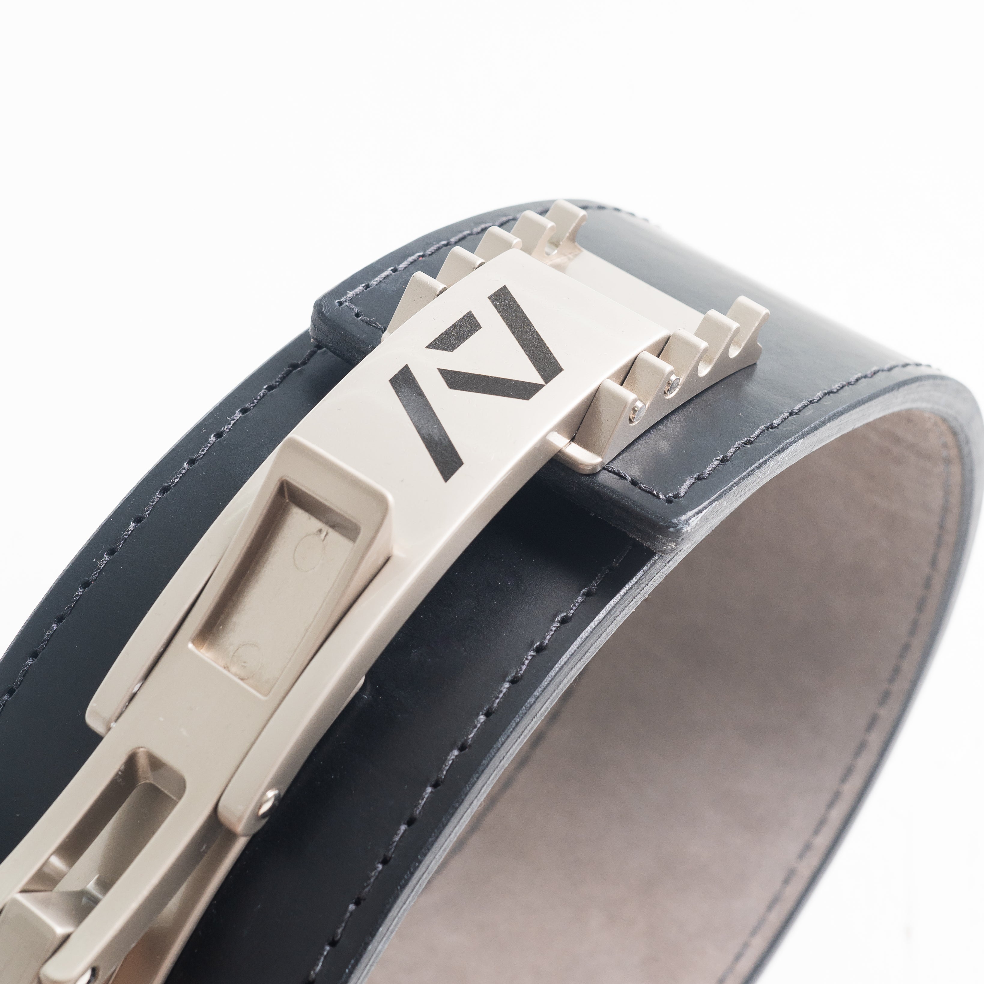 Etched A7 logo detail on the polished silver PAL Buckle, combining clean branding with high performance.