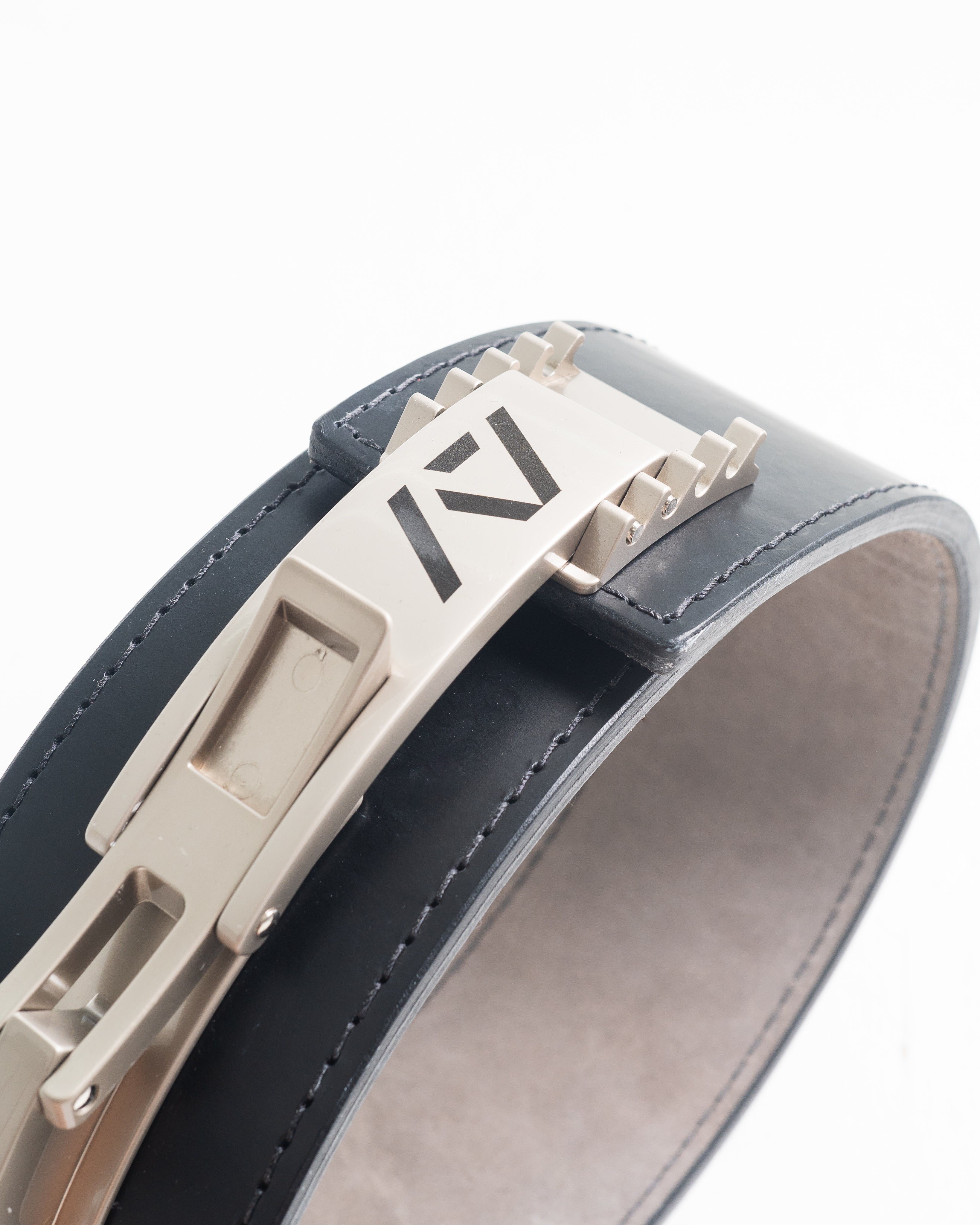 Etched A7 logo detail on the polished silver PAL Buckle, combining clean branding with high performance.