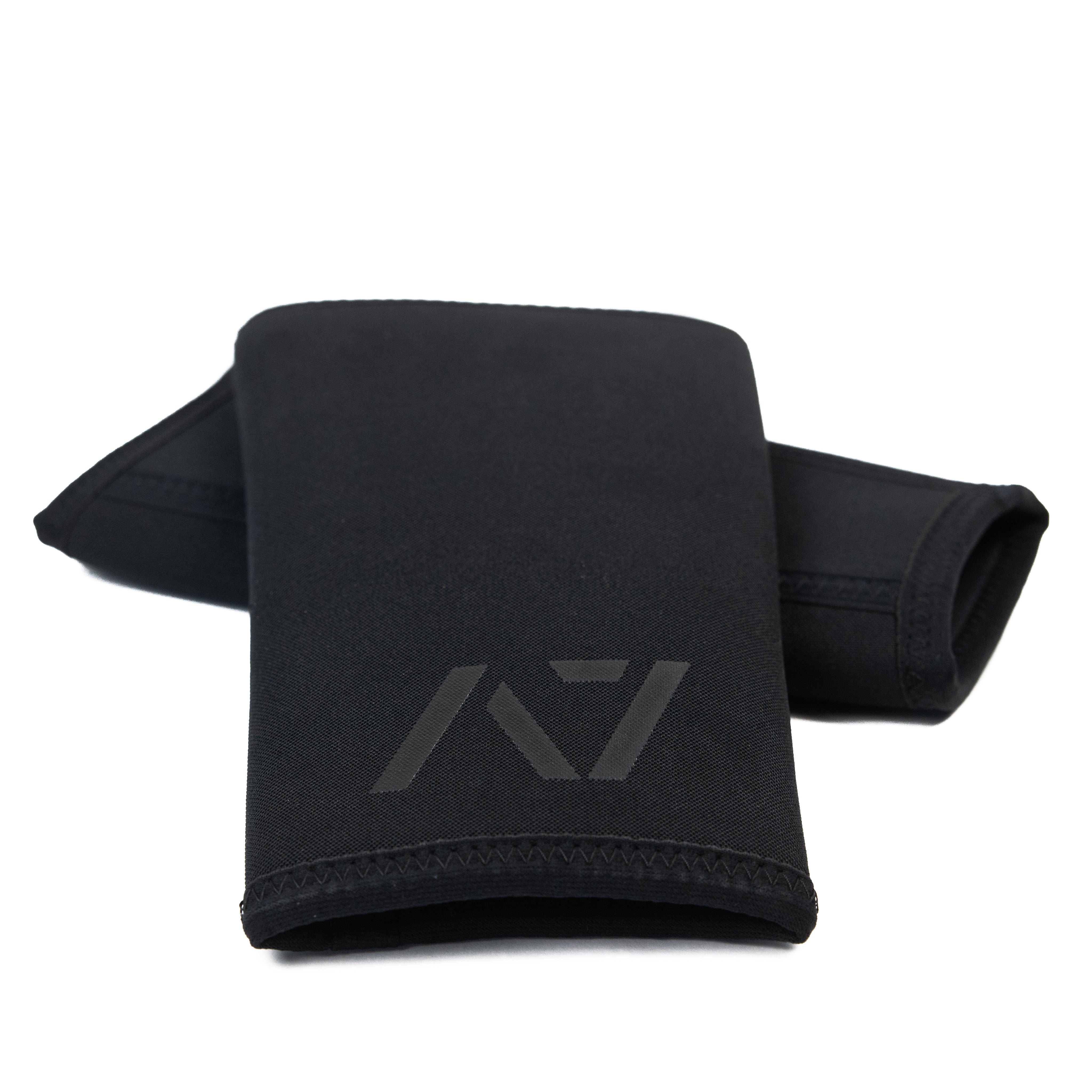 Flat lay of A7 Stealth Stiff CONE Knee Sleeves showing pair side-by-side in black colorway with tapered cut and double rear seams.